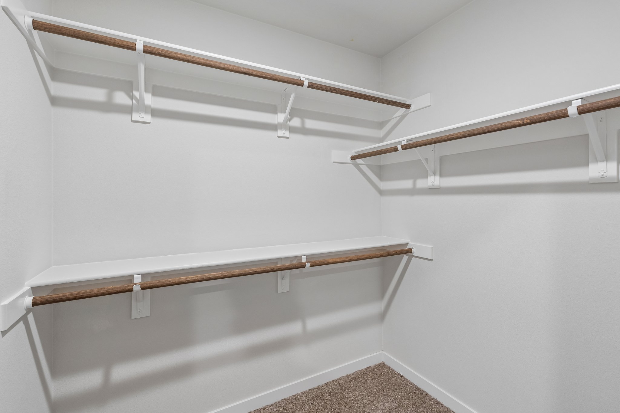 A white staircase with white walls.