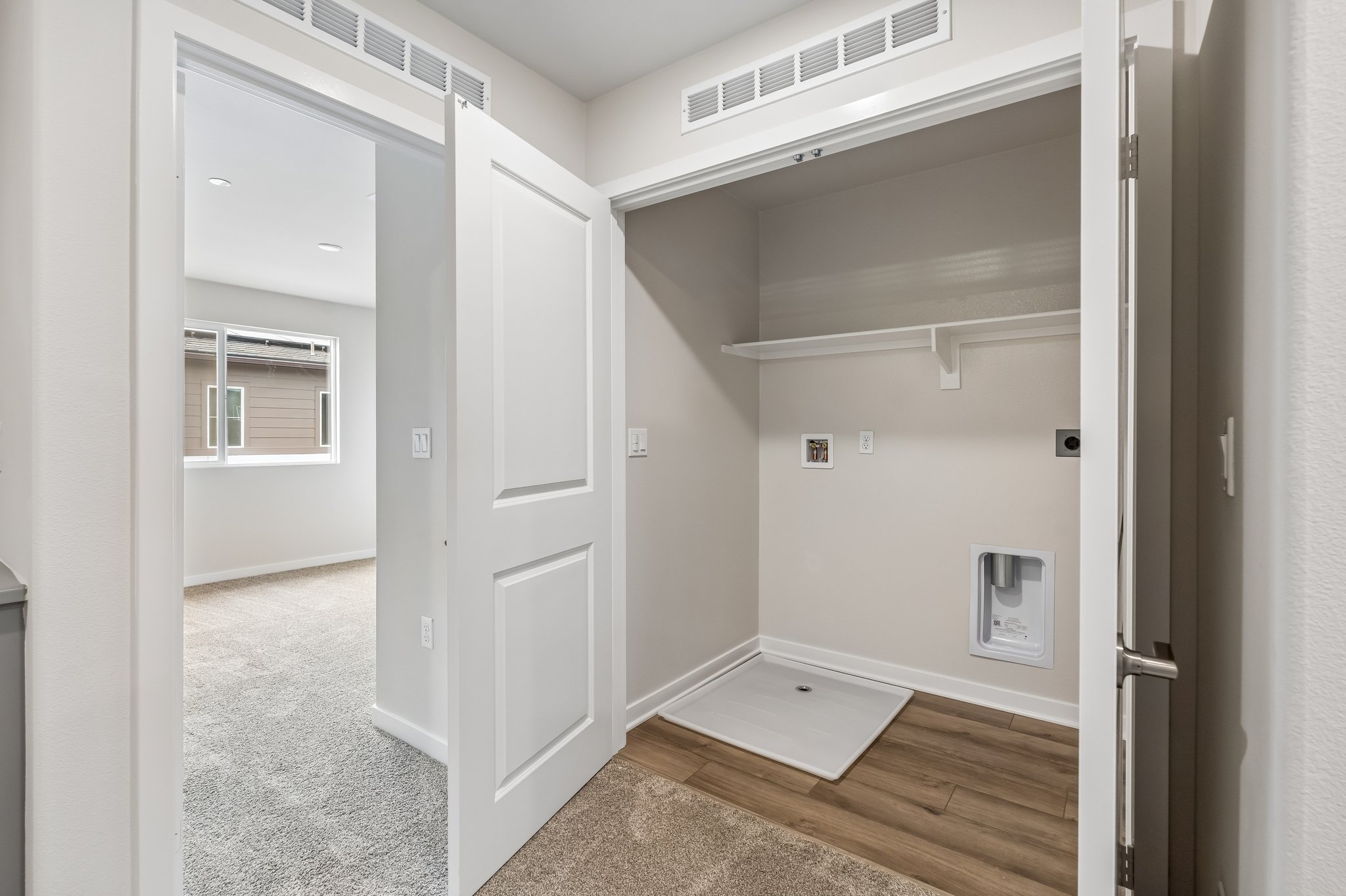 A hallway with white doors.