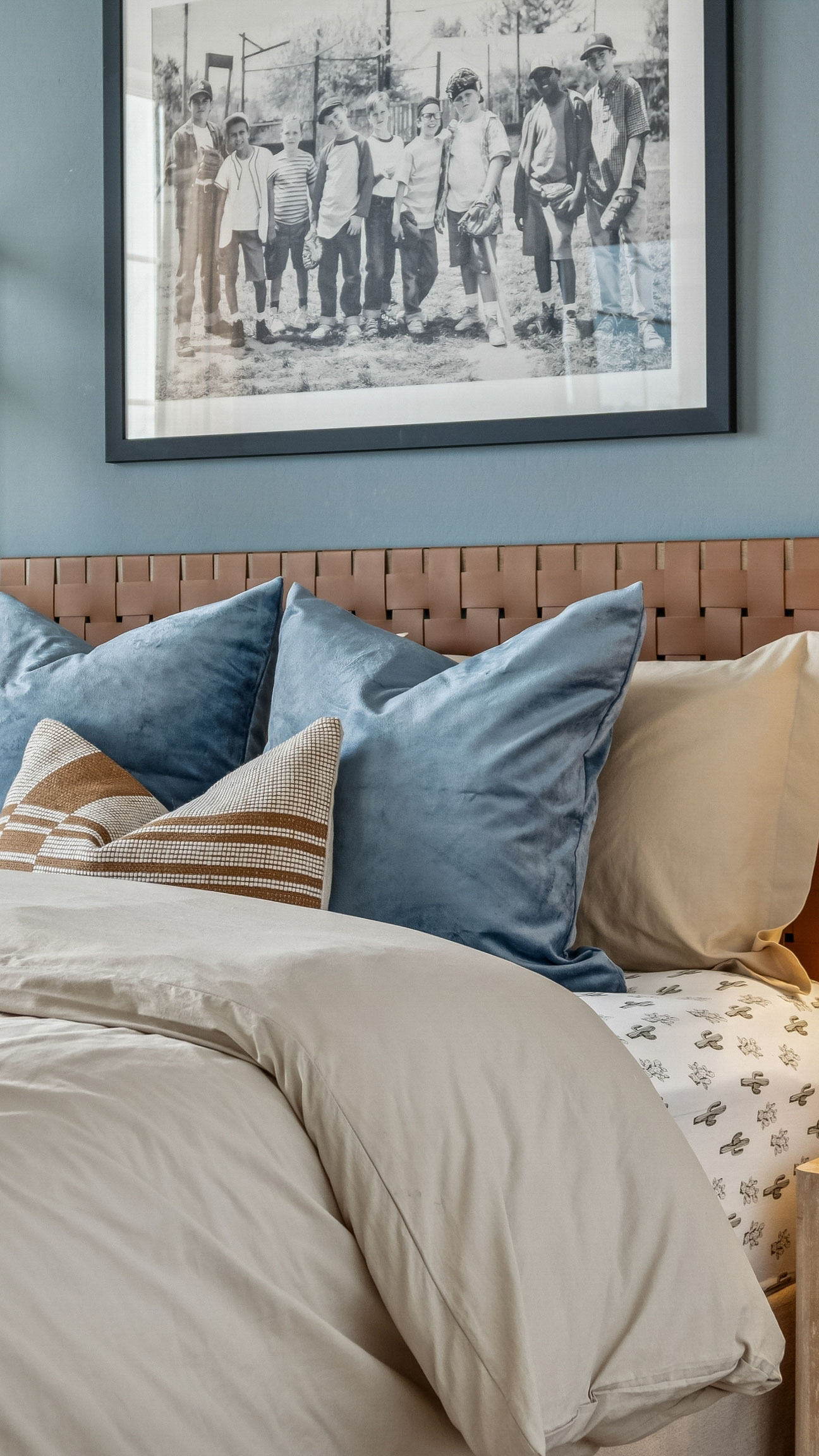 fluffy primary bed with contrast wall and deep teal color palette traditional home design model home -  New construction homes for sale Goodyear AZ Resort style amenities & founder incentives to the lucky few first homeowners.