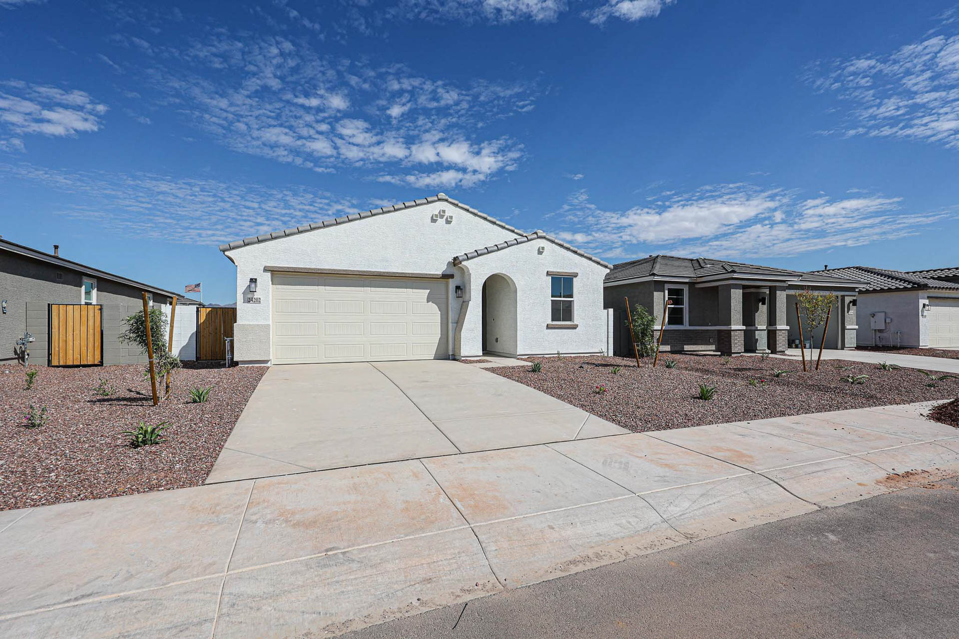 A driveway leading to a house.