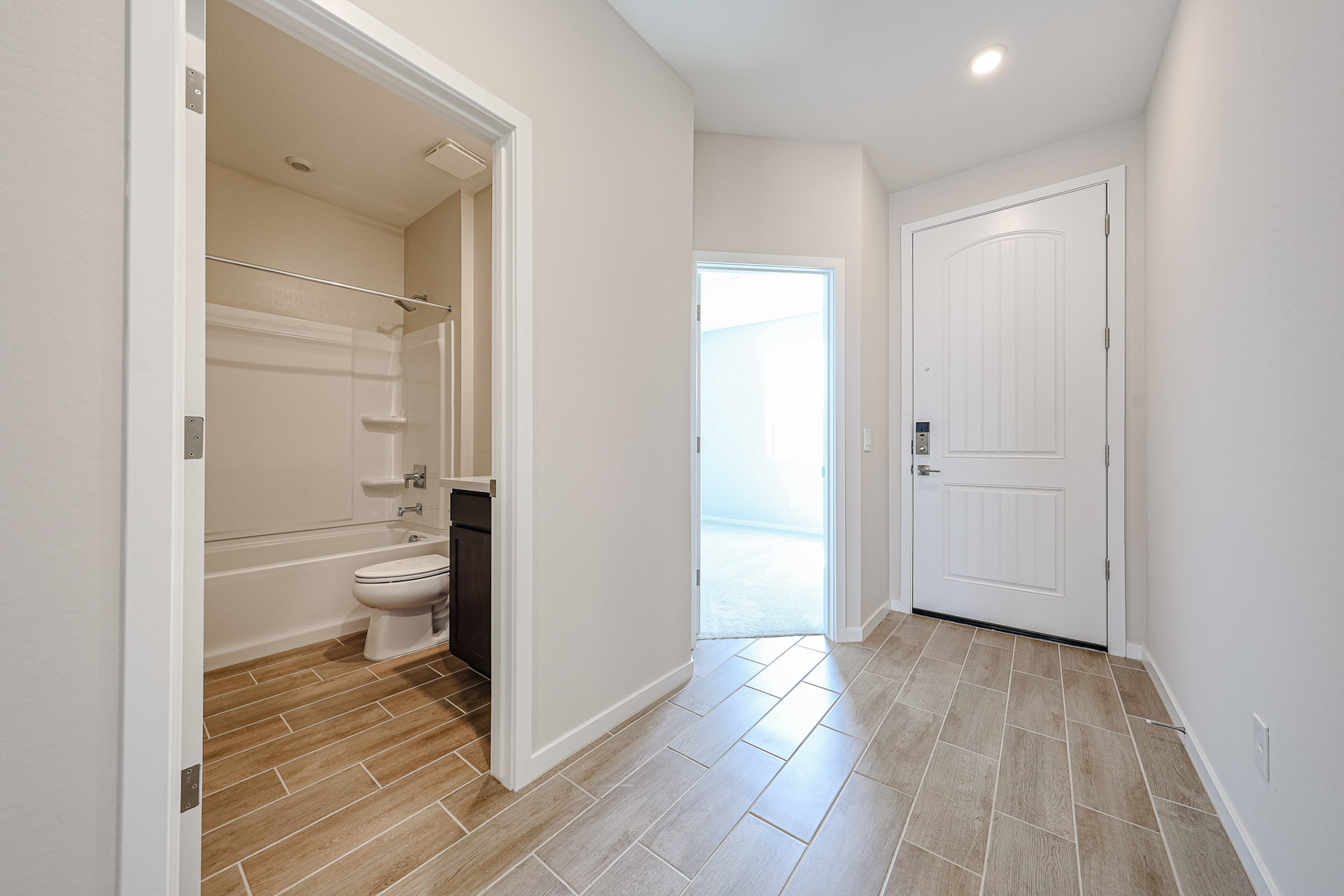A bathroom with a toilet and shower.