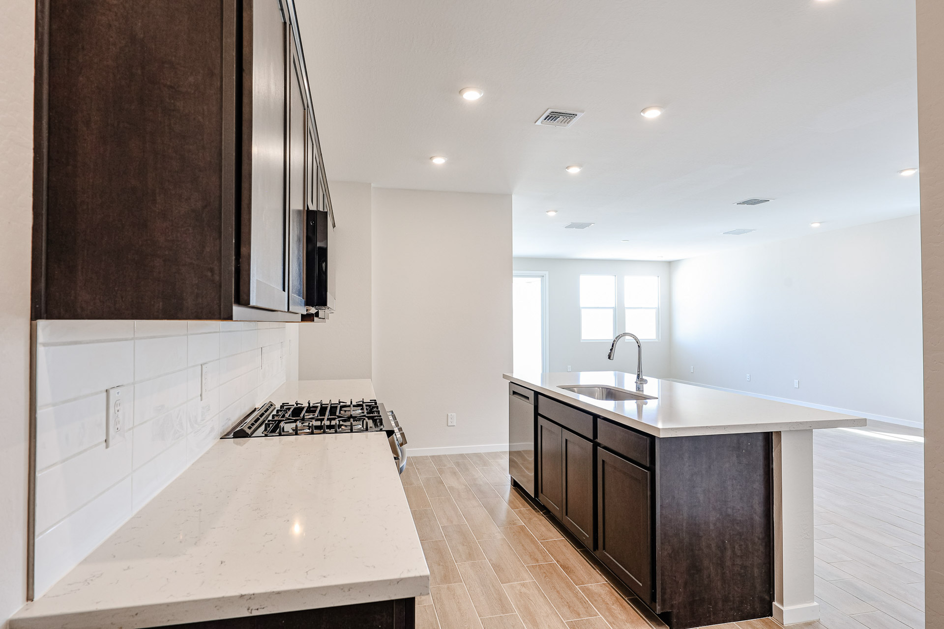A kitchen with a sink and cabinets.