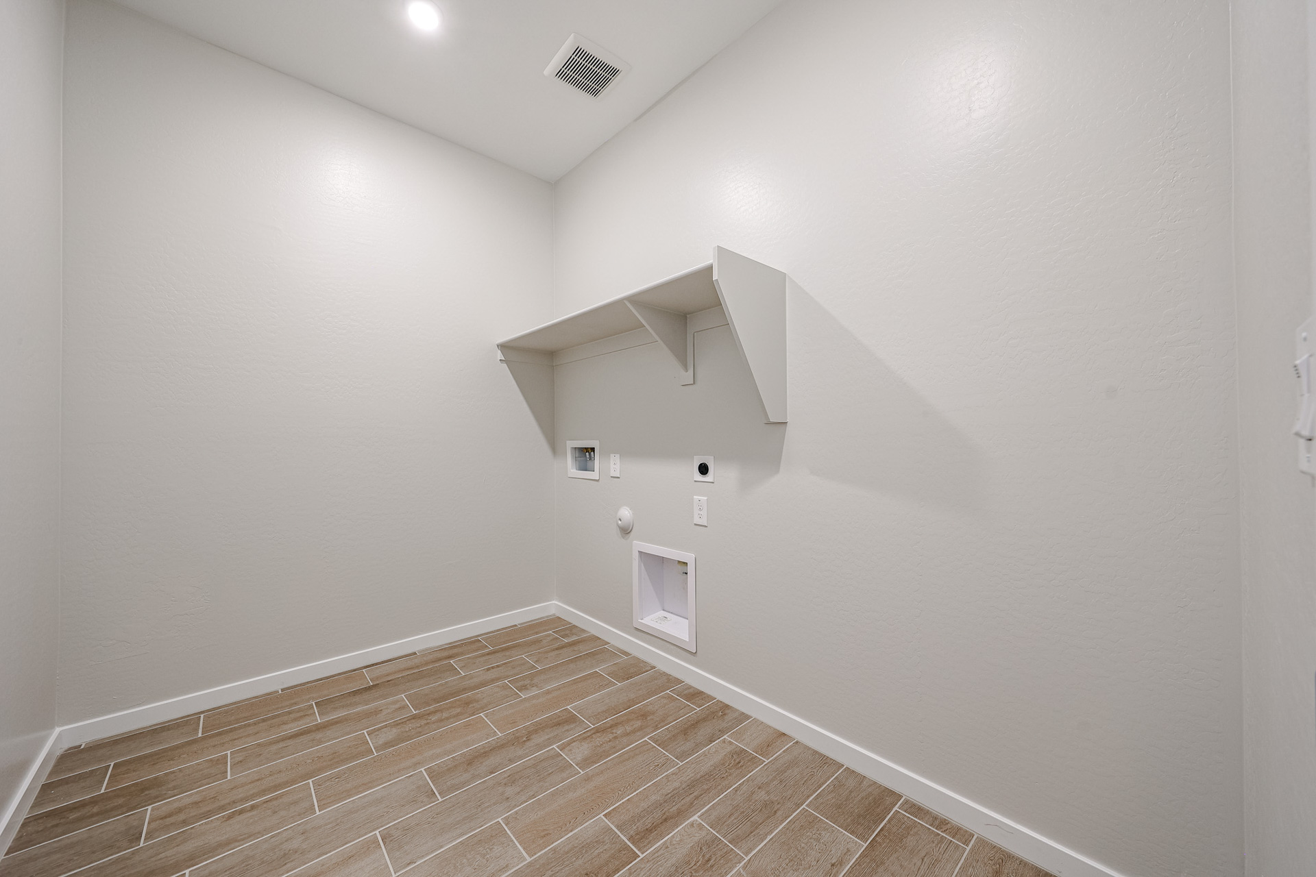 A hallway with a tile floor.