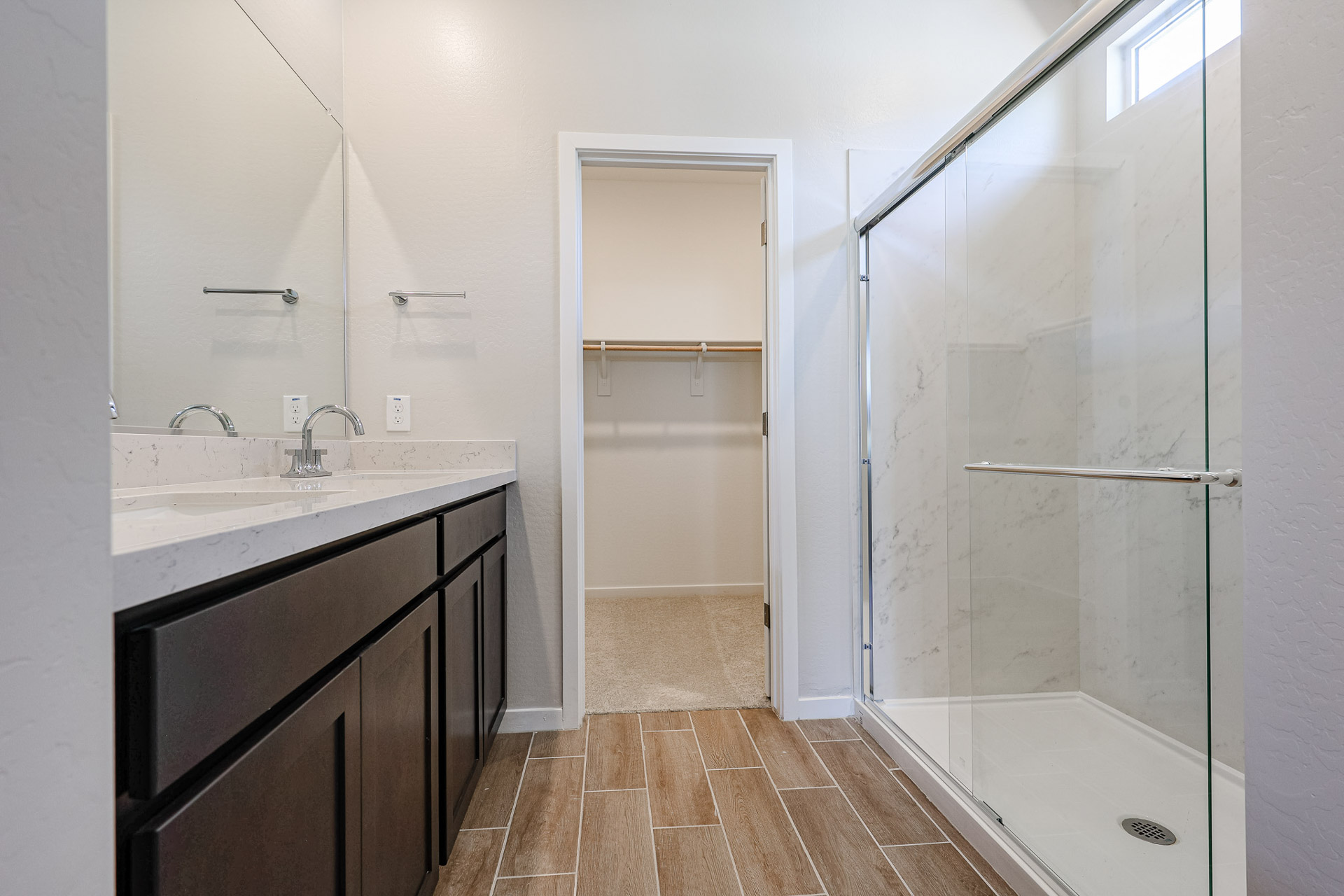 A bathroom with a glass shower.