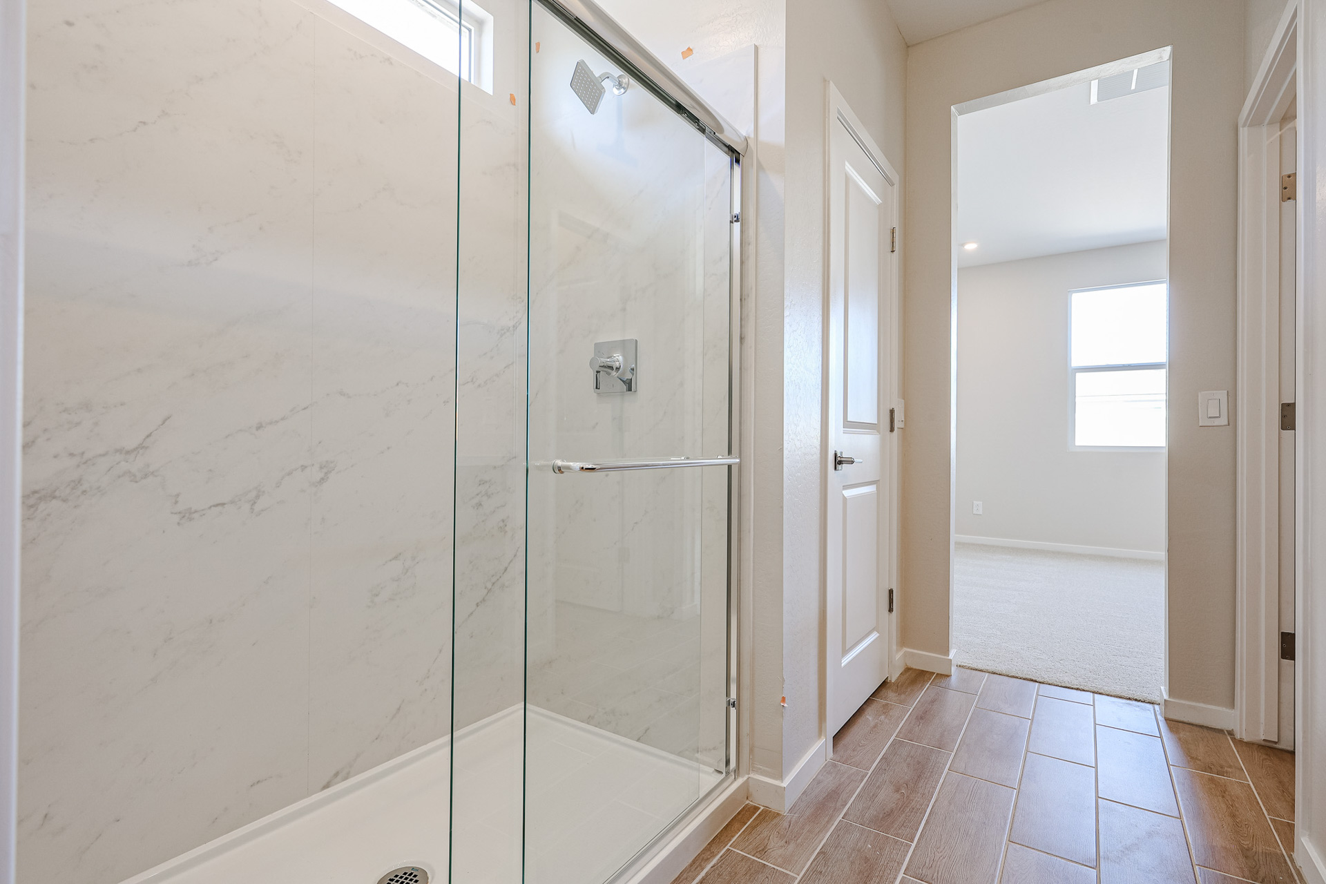 A bathroom with a glass shower.