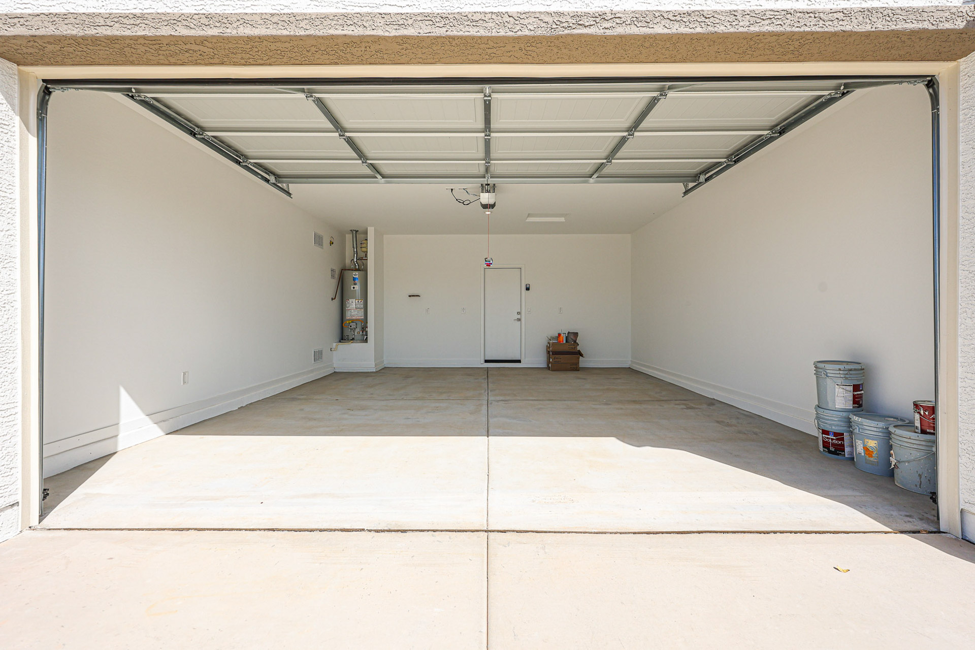 A room with white walls and a few white doors.