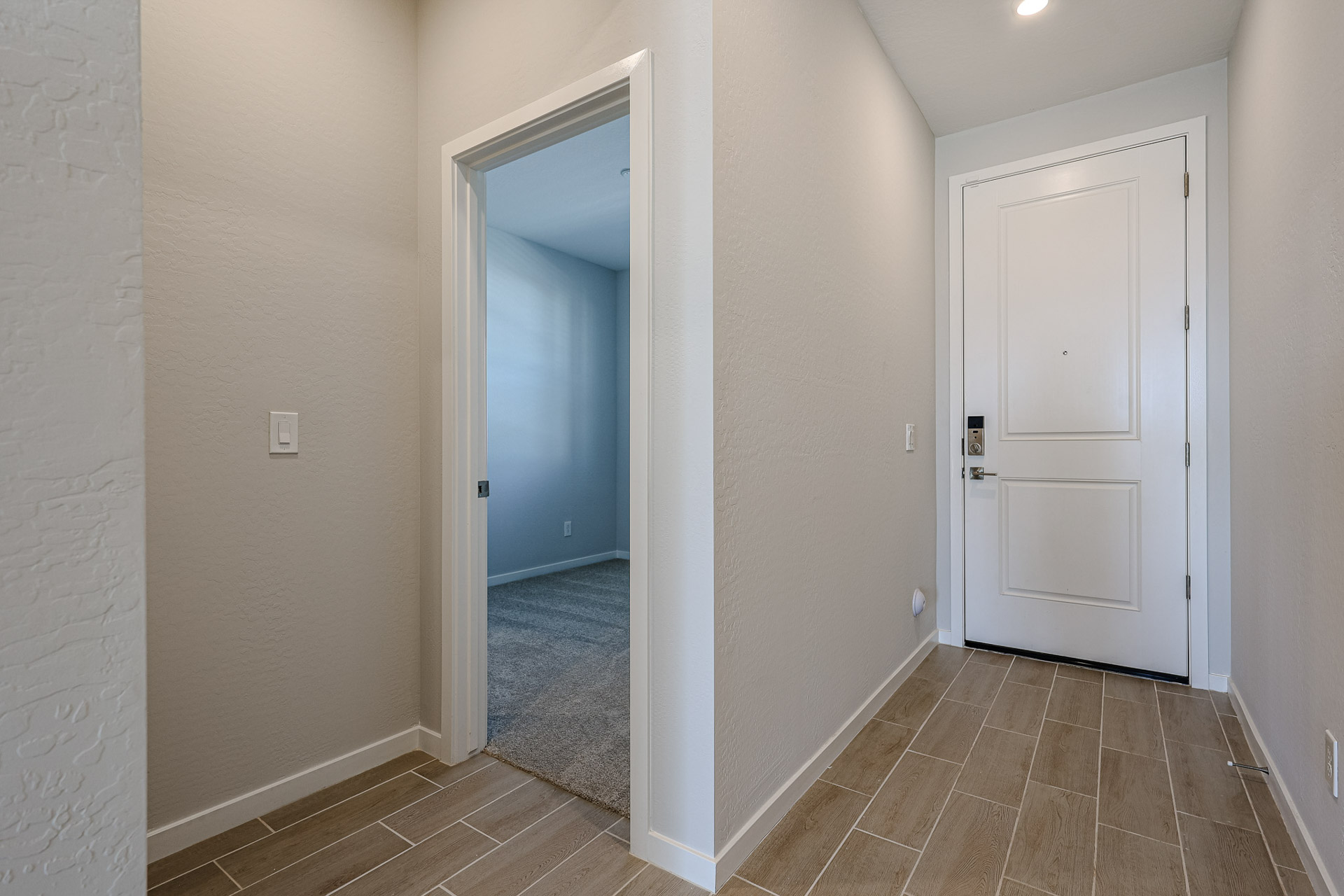 A hallway with white doors.