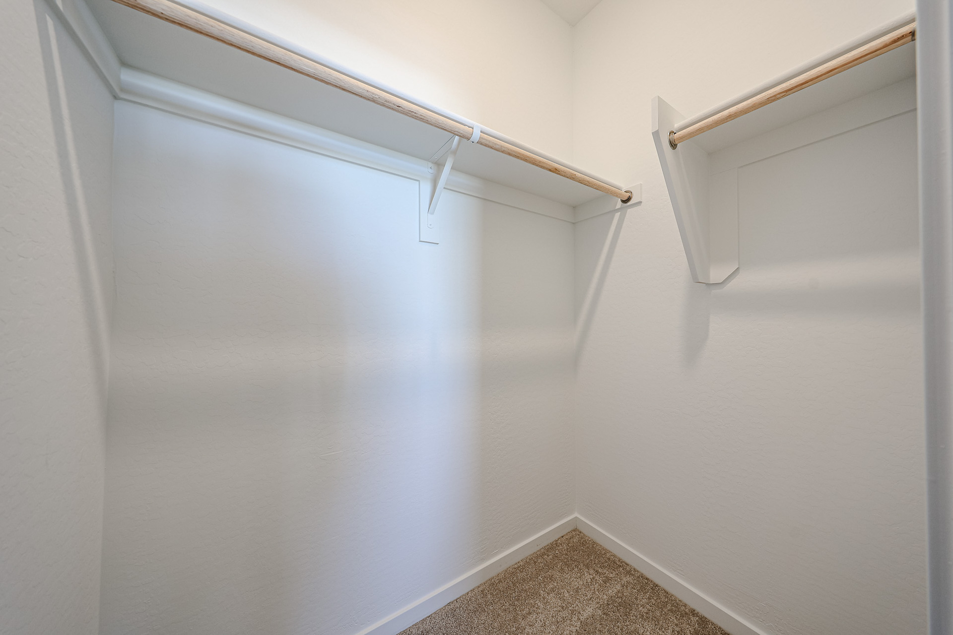 A white wall with a white door.