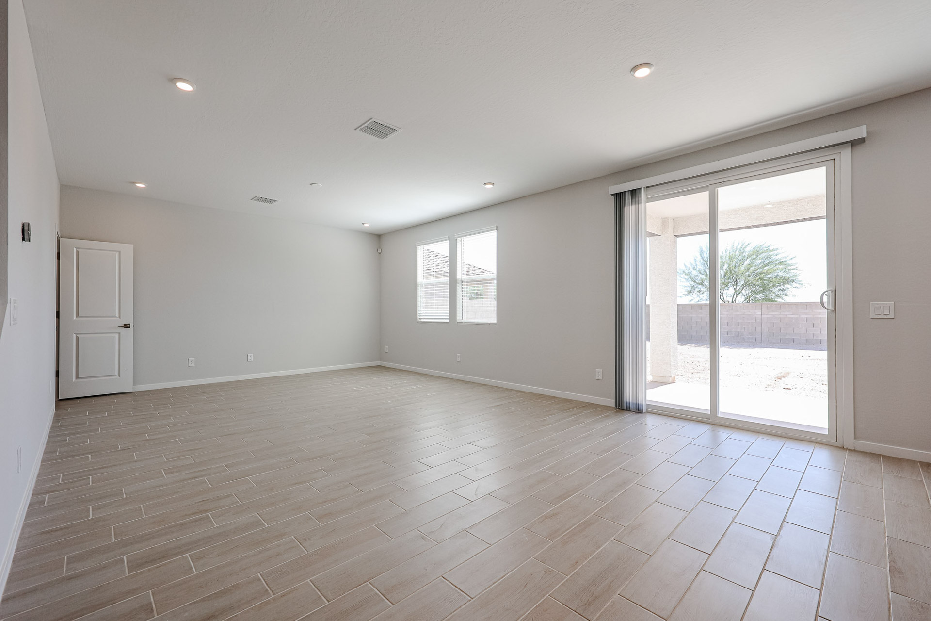 A room with a wood floor and a wood floor.