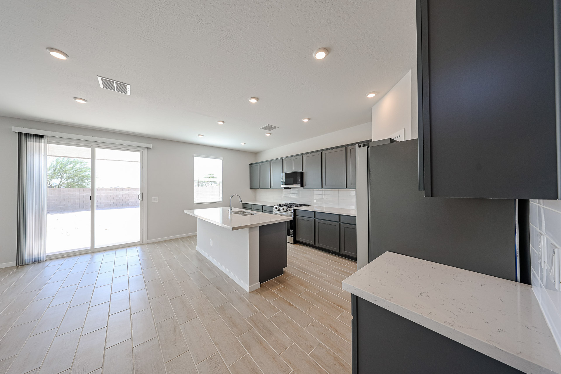 A kitchen with a wood floor.