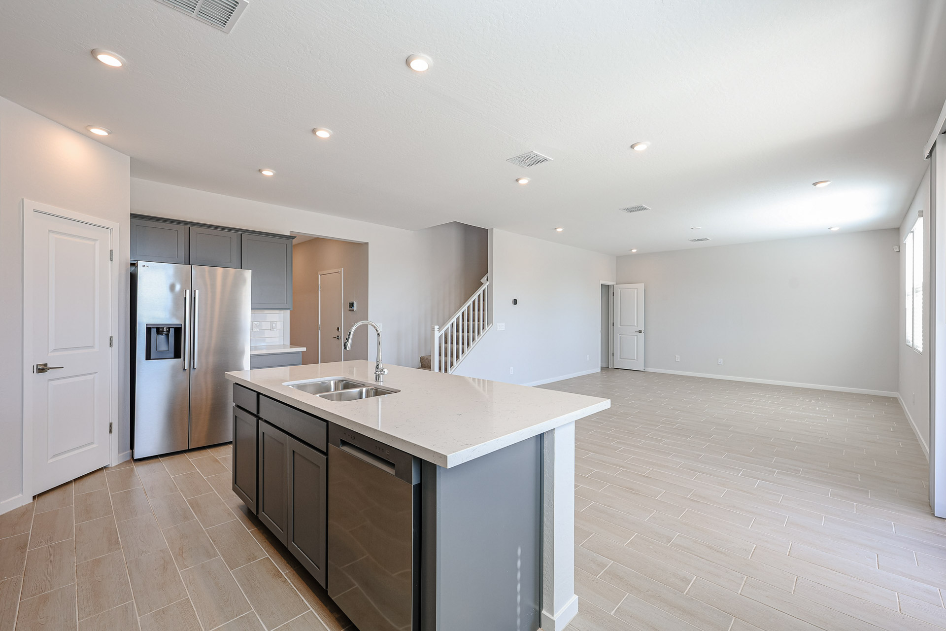 A kitchen with a bar and a sink.