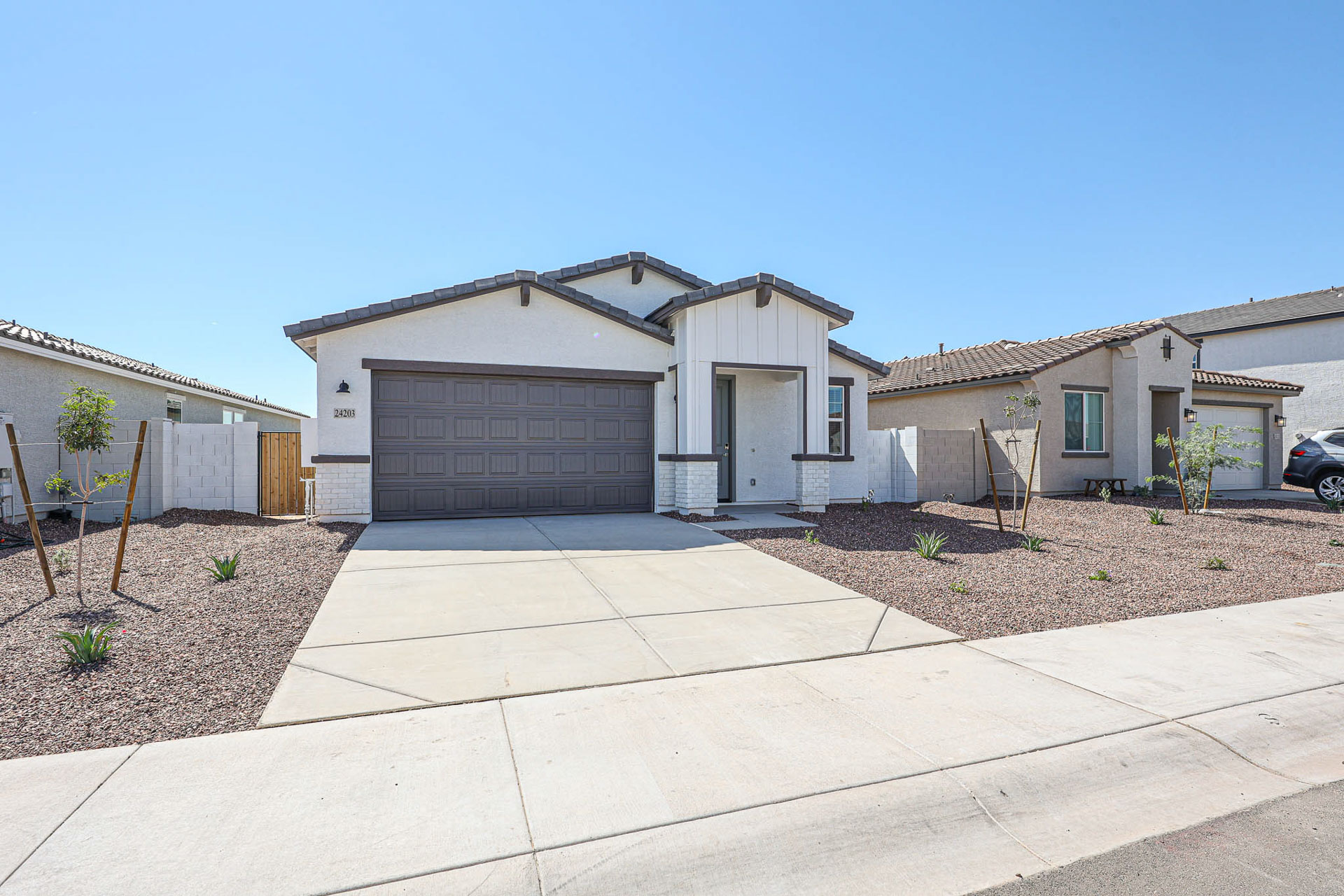 A house with garages and a driveway.