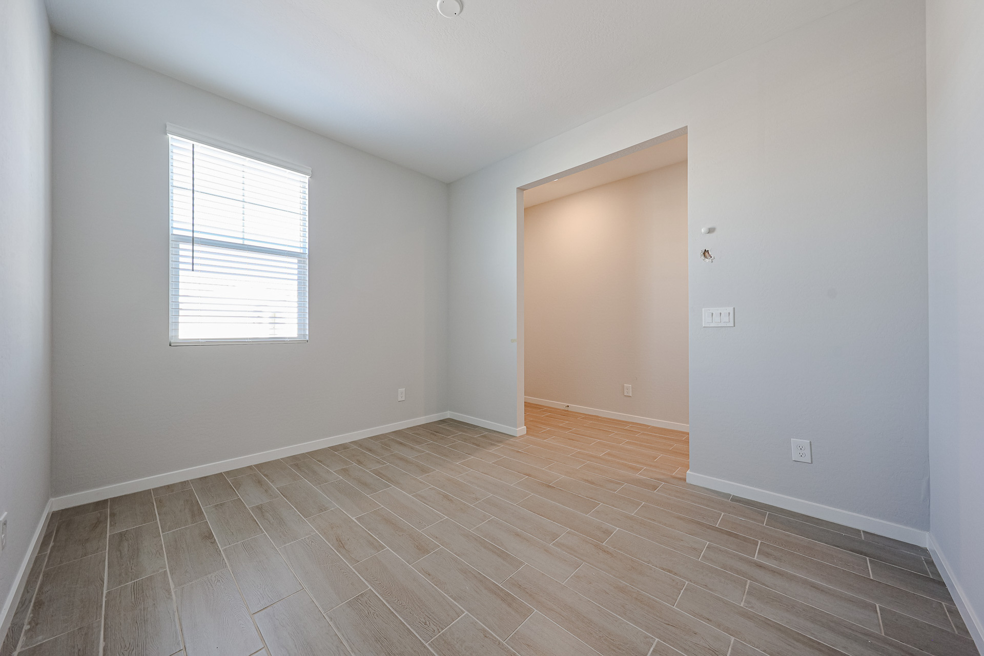 A room with a wood floor and a wood floor.