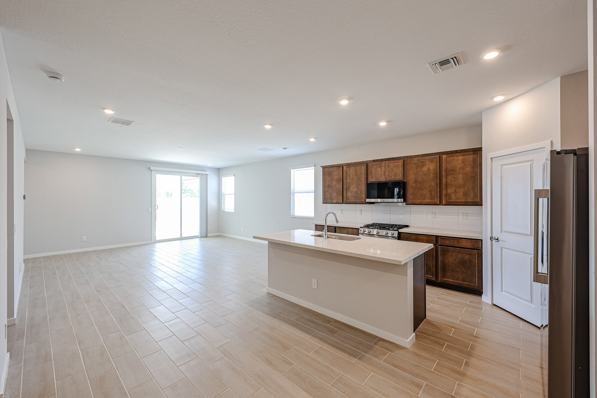 A kitchen with wooden floors.