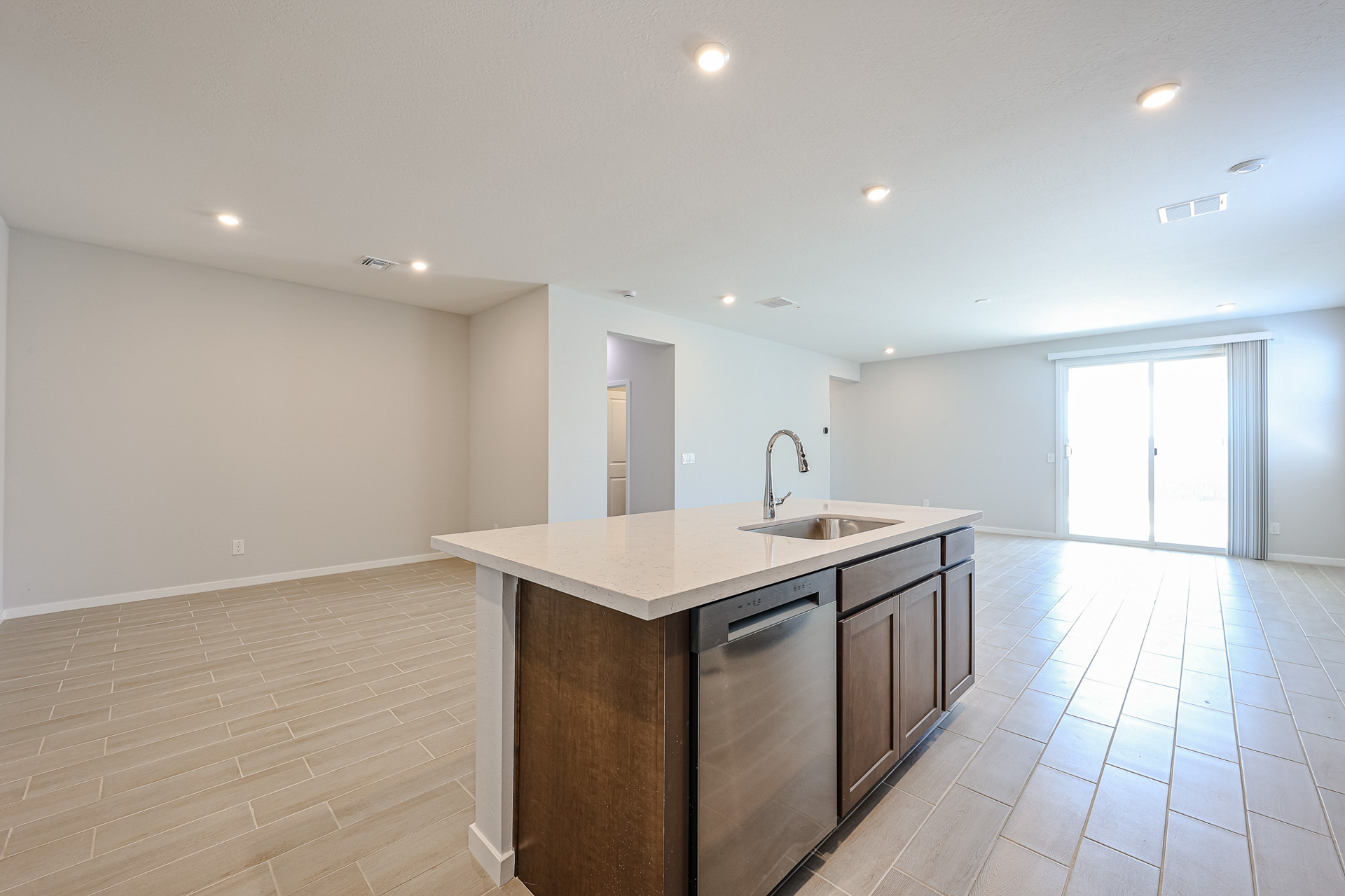 A kitchen with a wood floor.