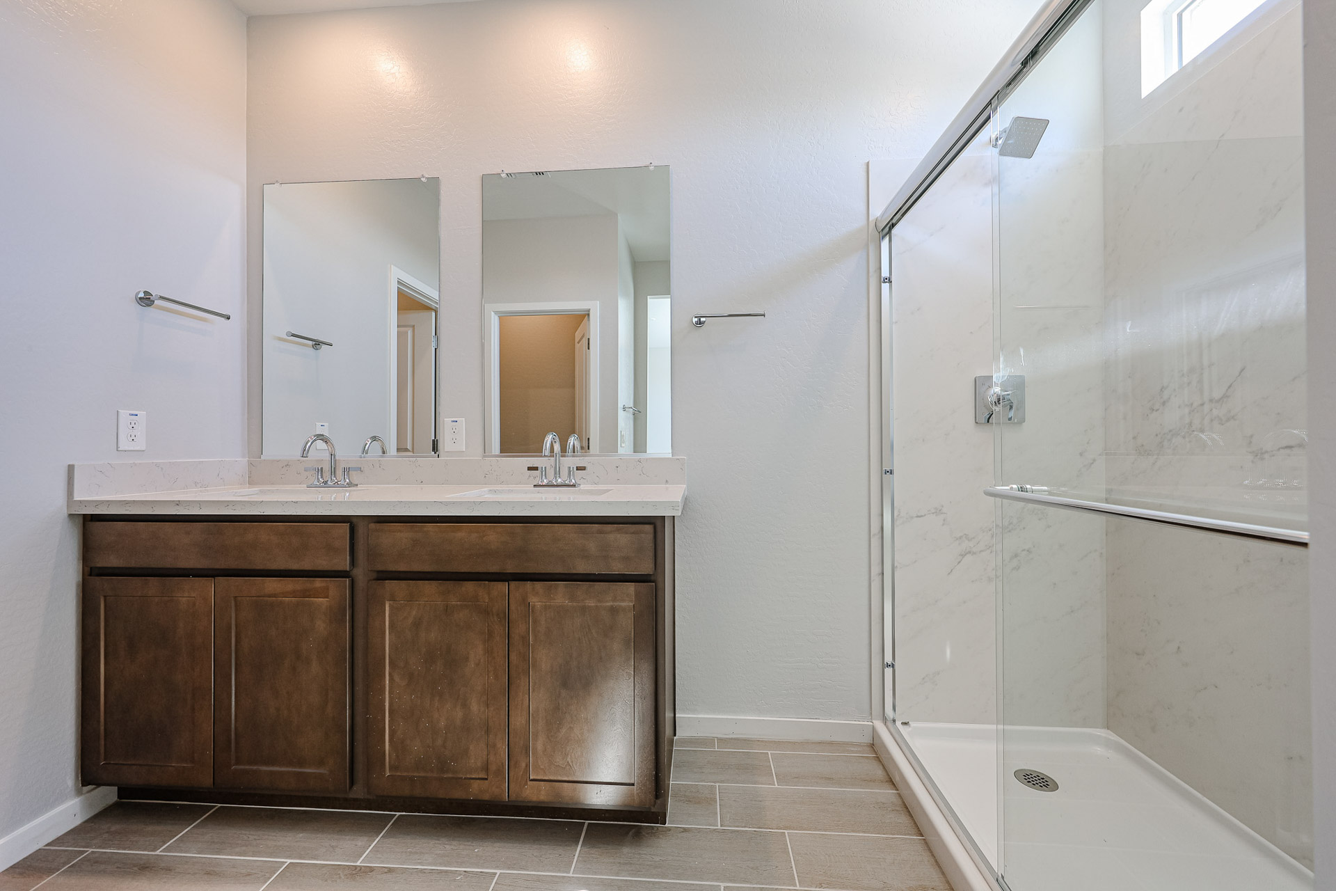 A bathroom with a glass shower.