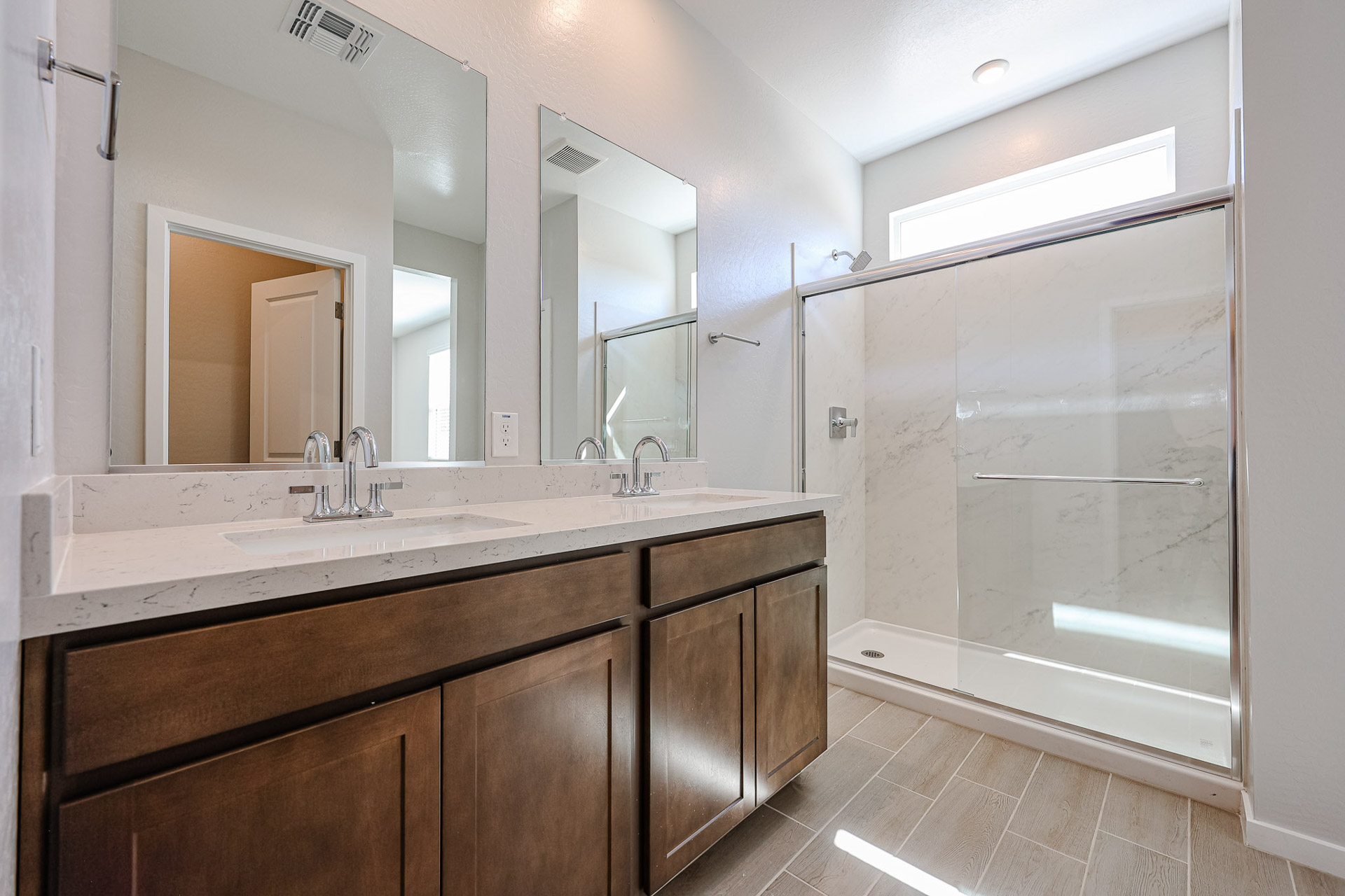A bathroom with a glass shower.