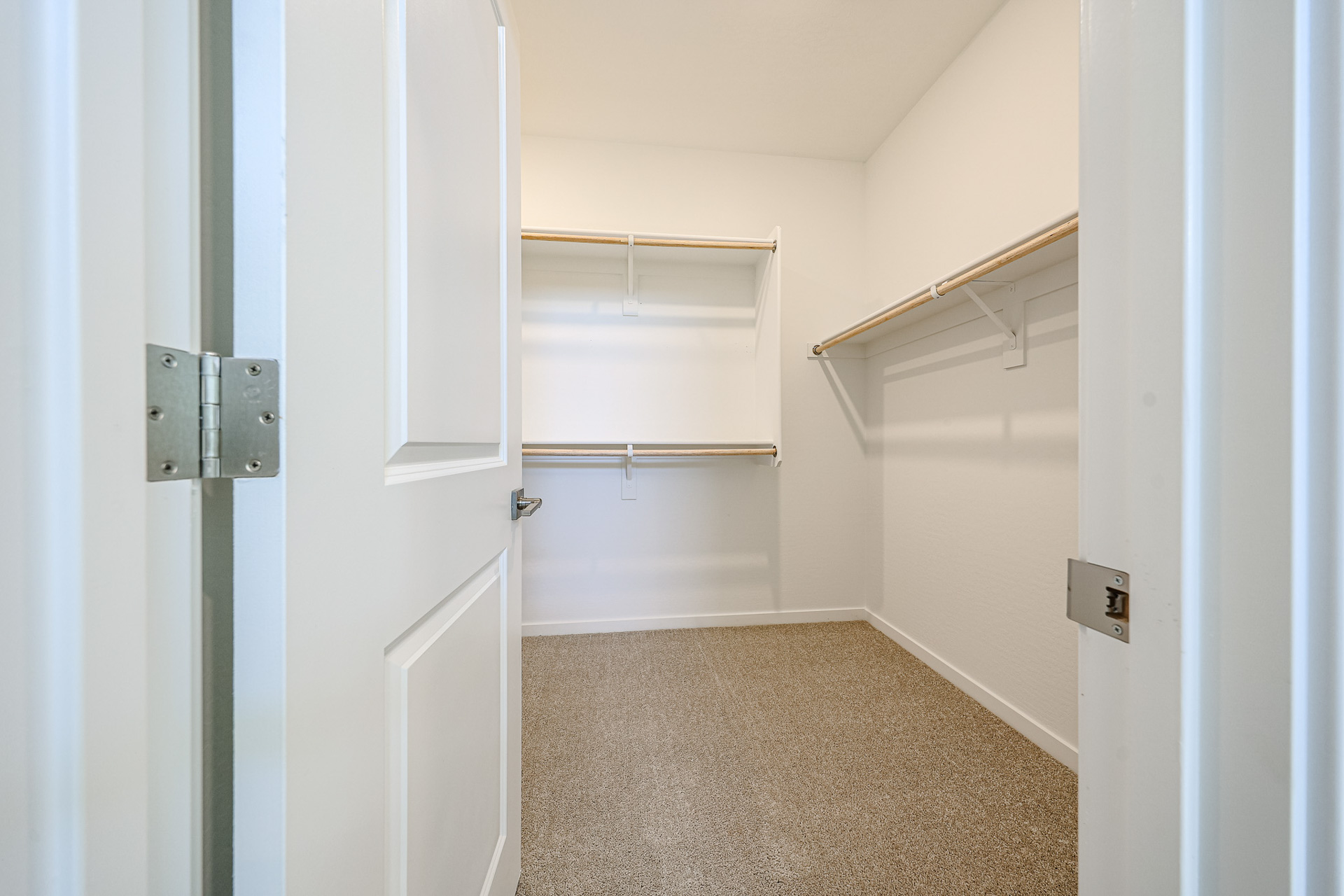 A hallway with white doors.