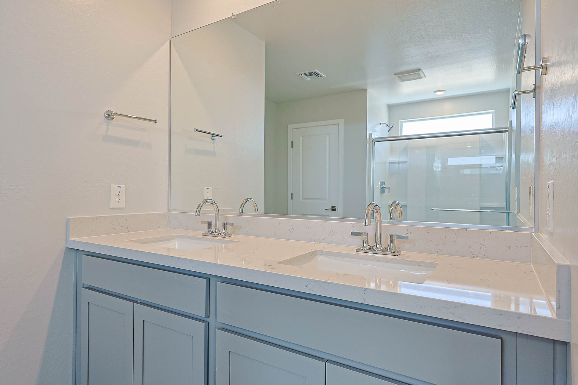 A bathroom with sinks and mirrors.