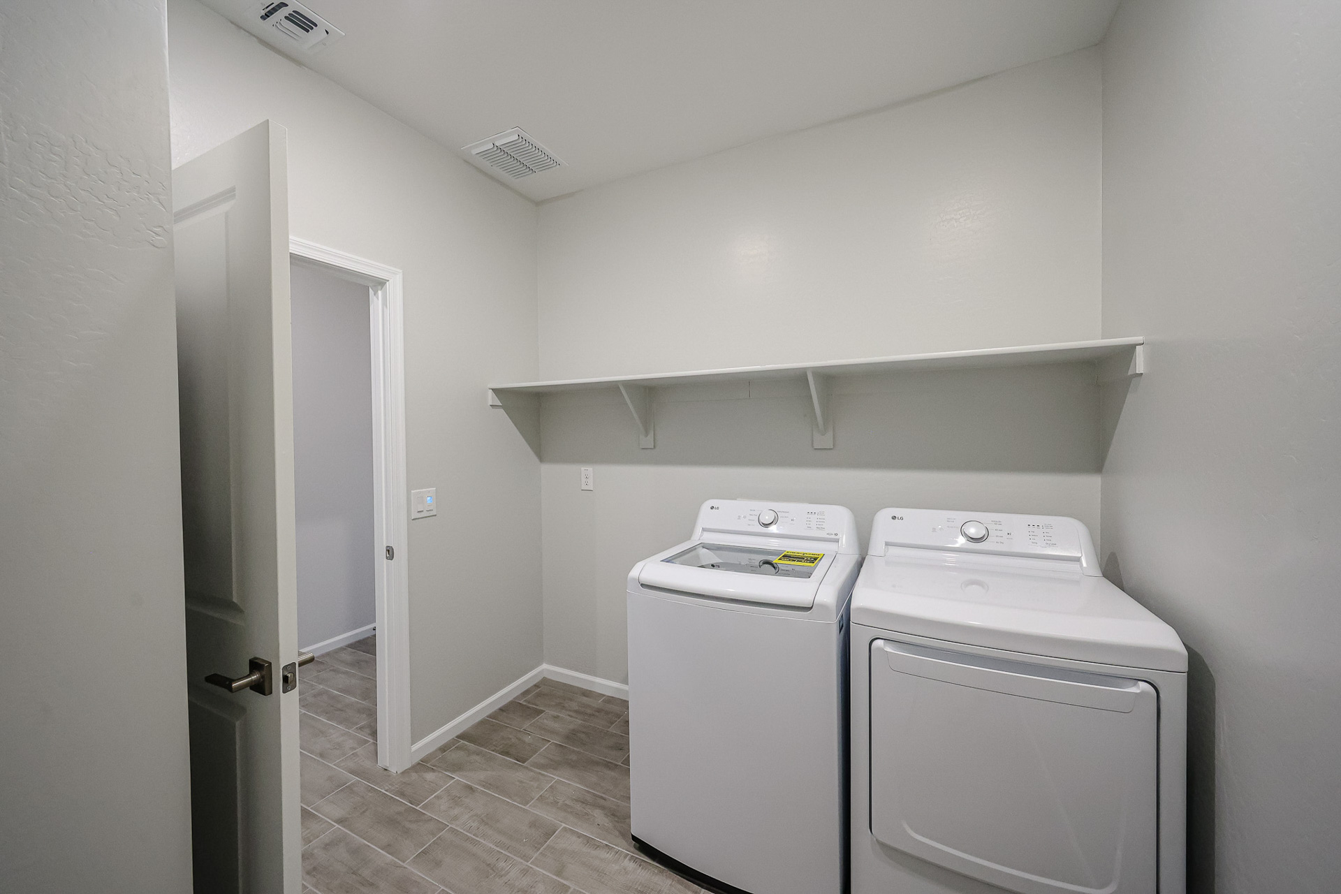 A laundry room with a washer and dryer.