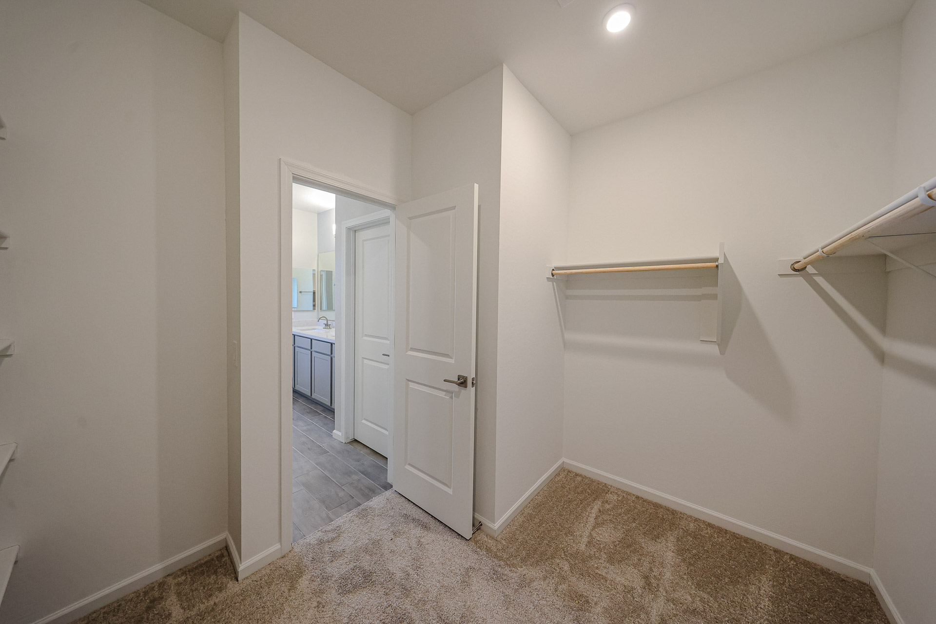 A hallway with white walls.