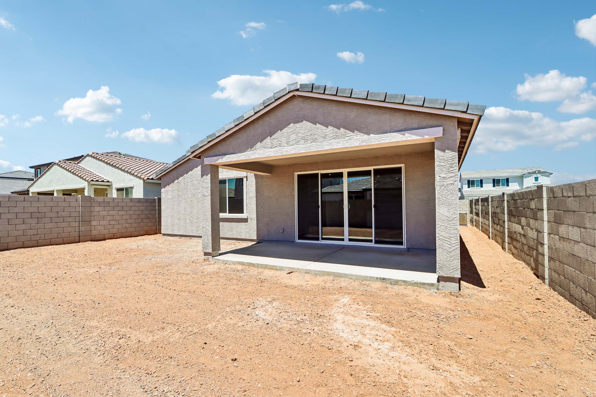 A house with a dirt yard.