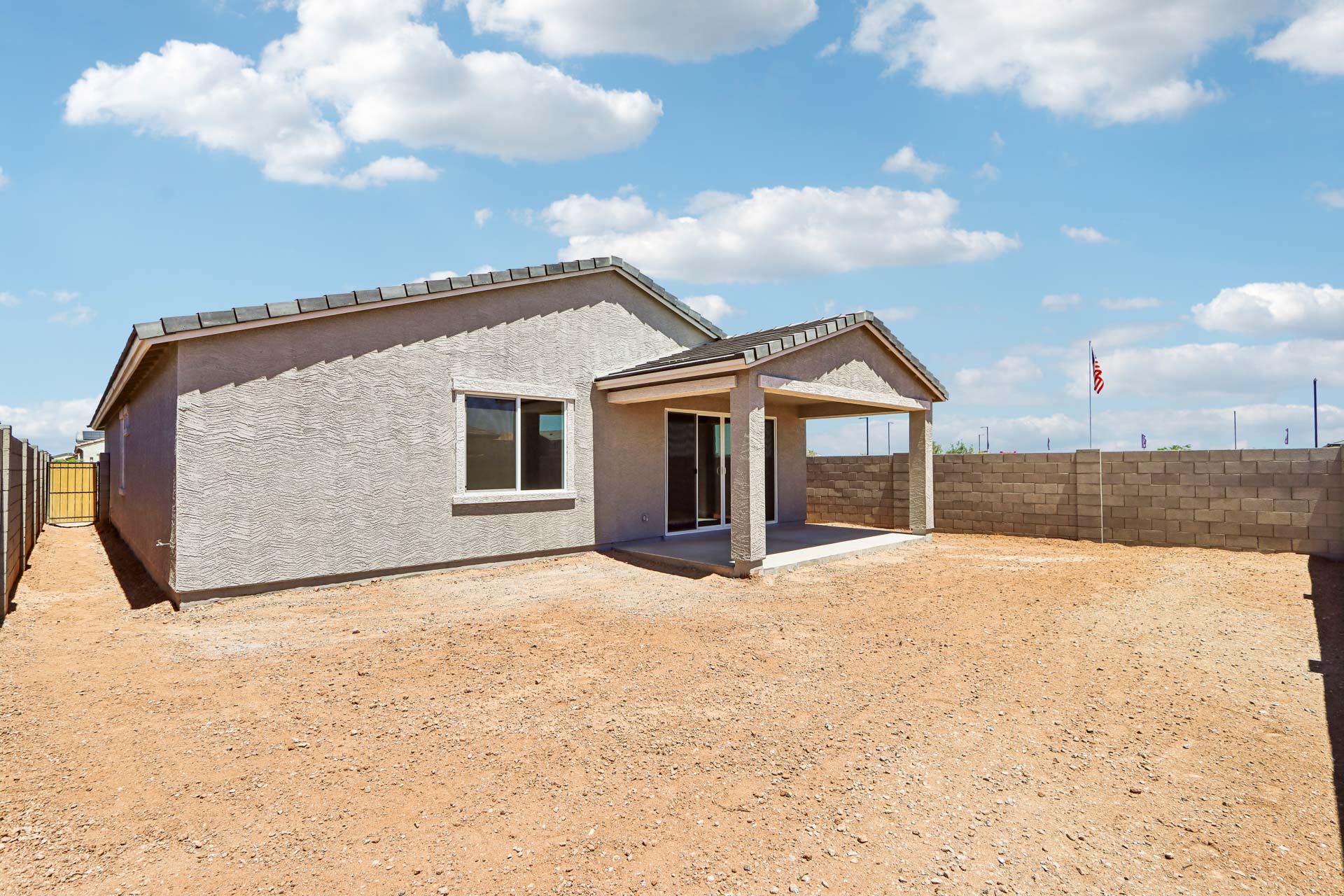 A building with a dirt yard.