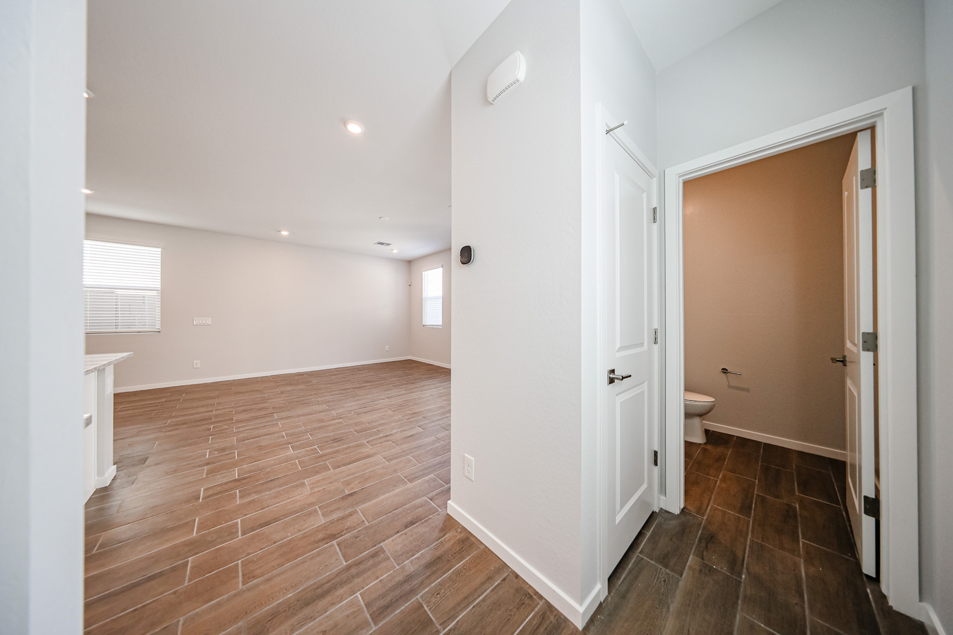 A bathroom with a wood floor.
