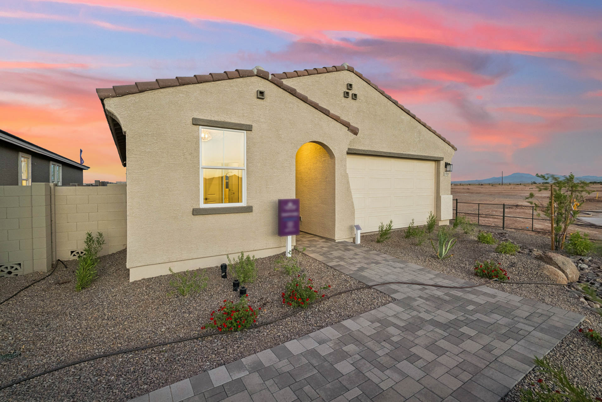 A house with a stone driveway.