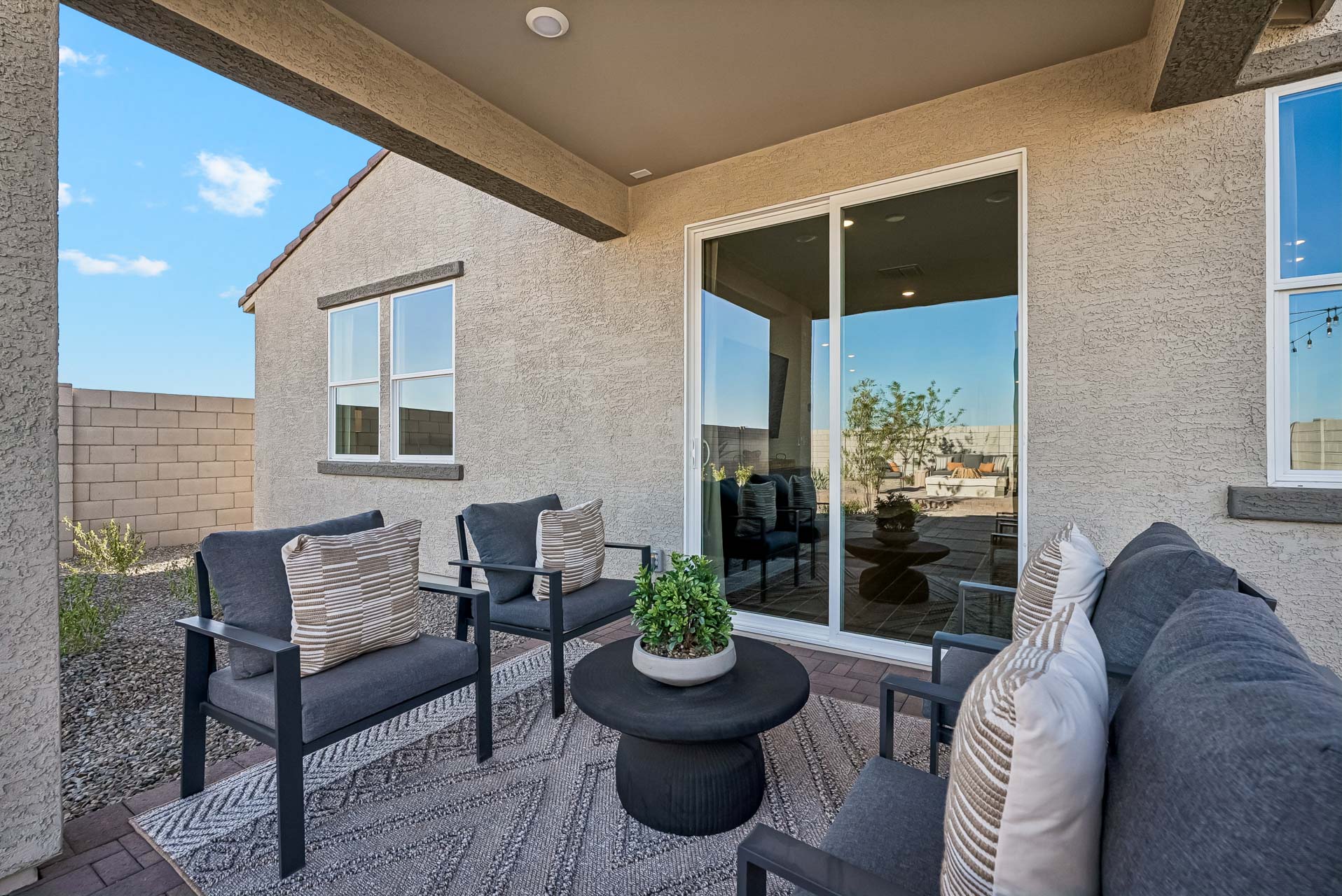 A living room with a large glass door.