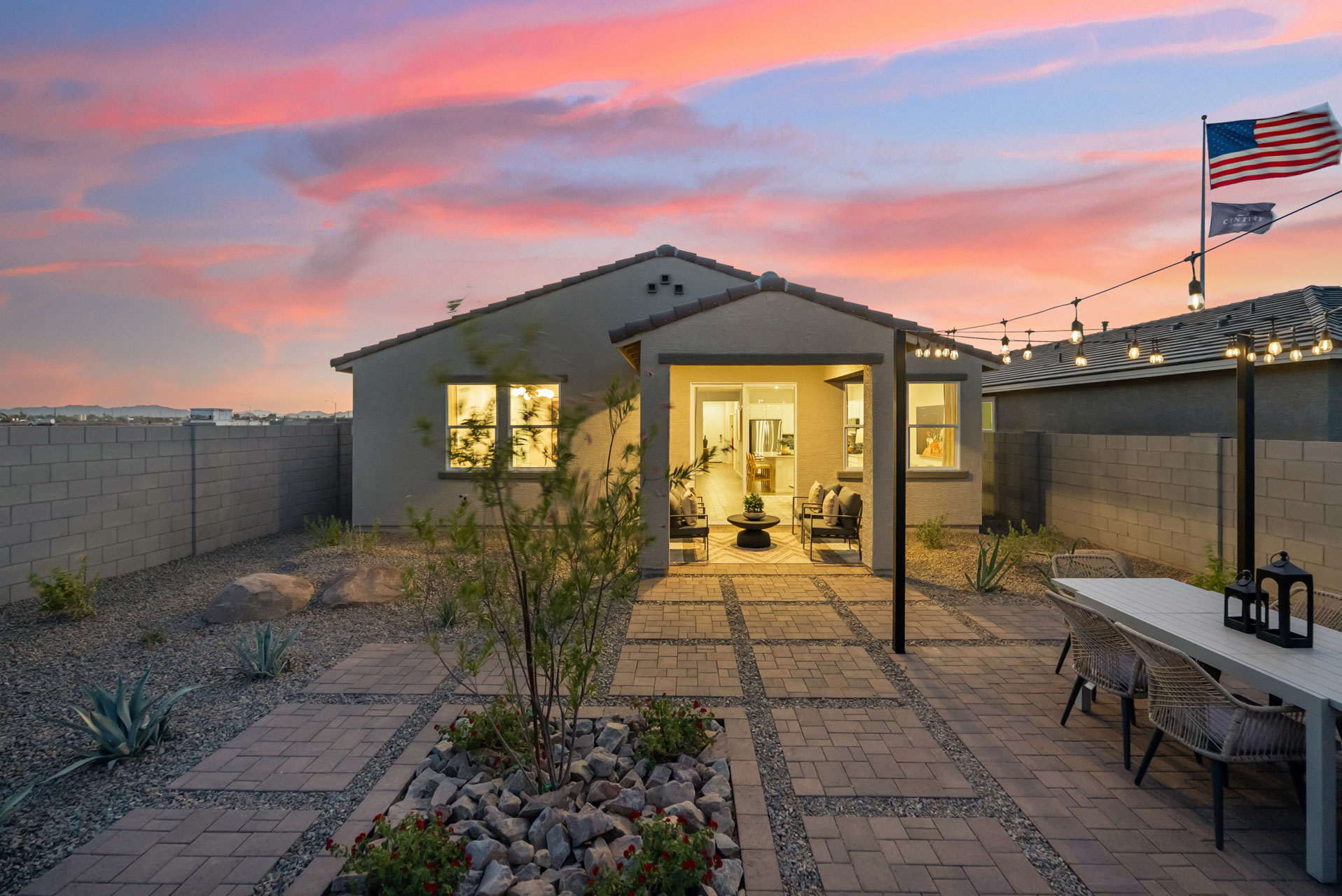A house with a stone patio.