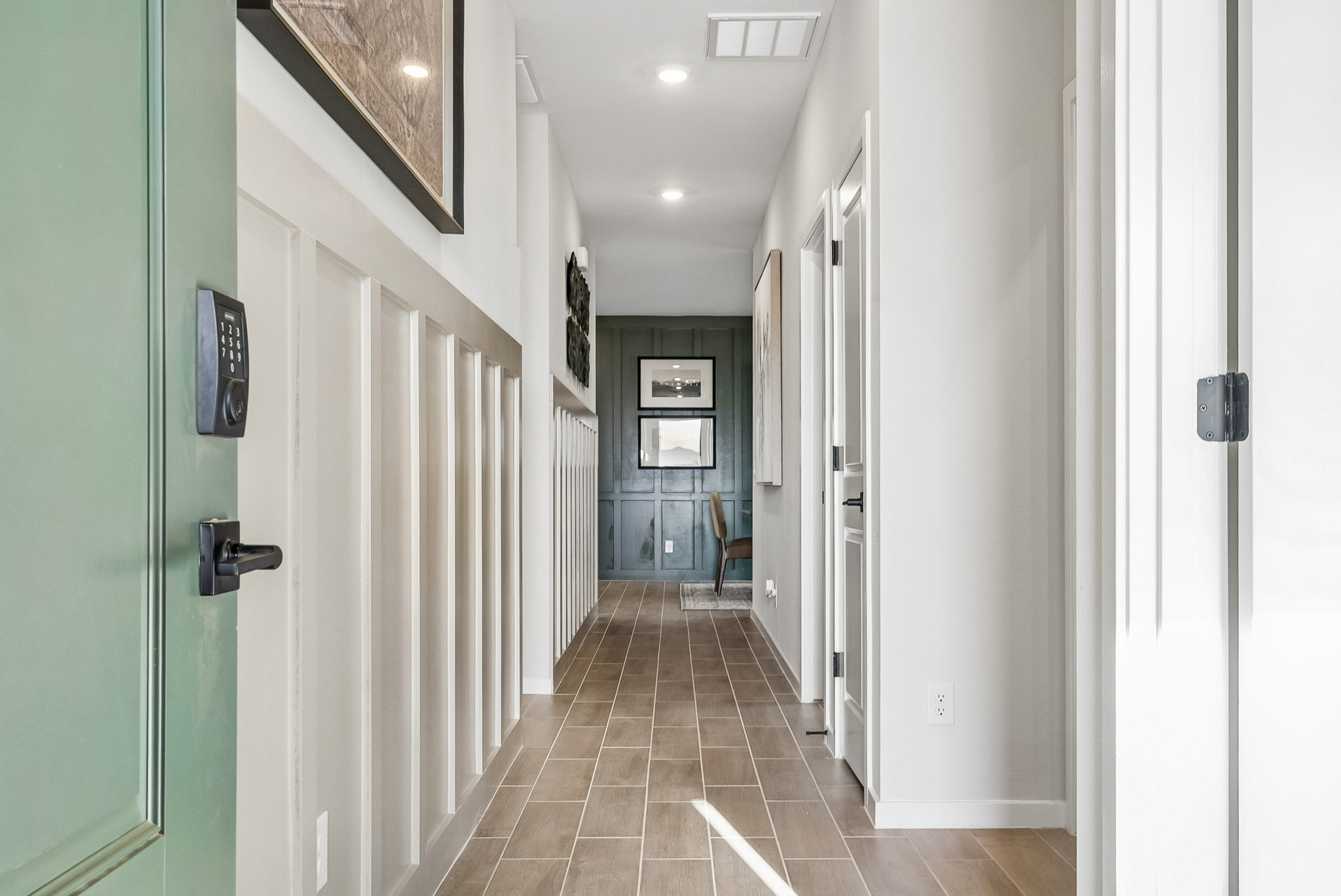 A hallway with white doors.