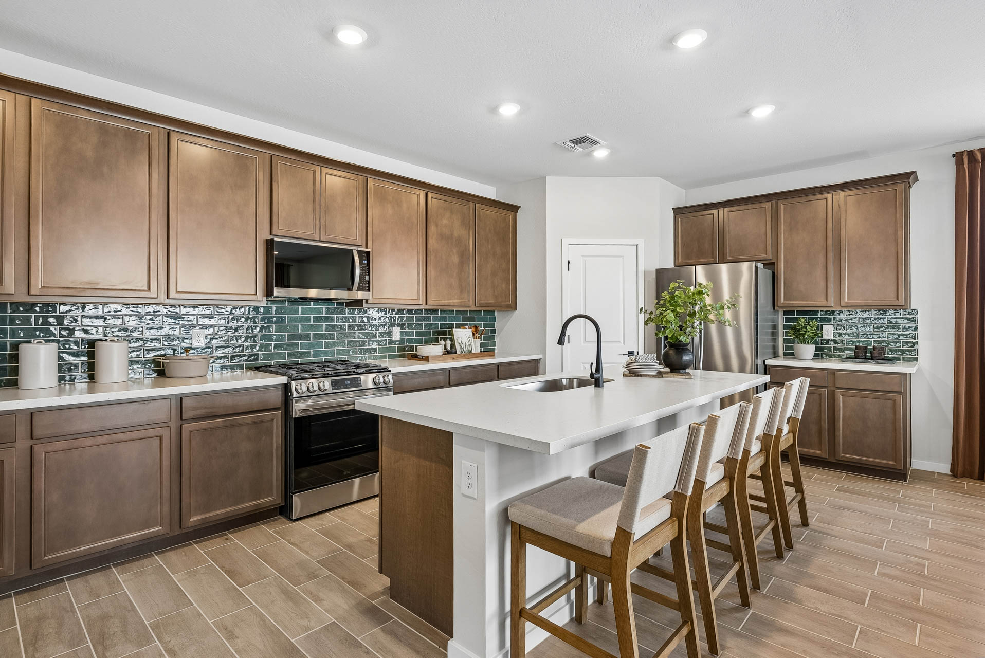 A kitchen with wooden cabinets.