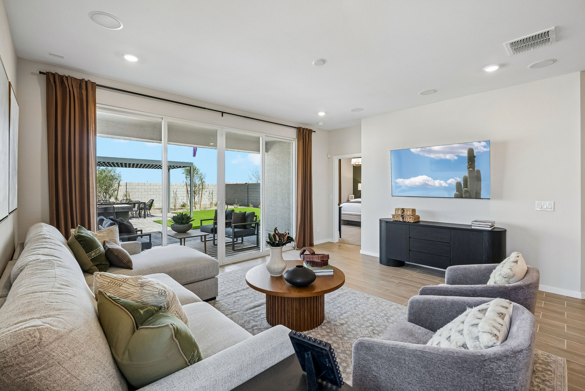 A living room with a large glass door.