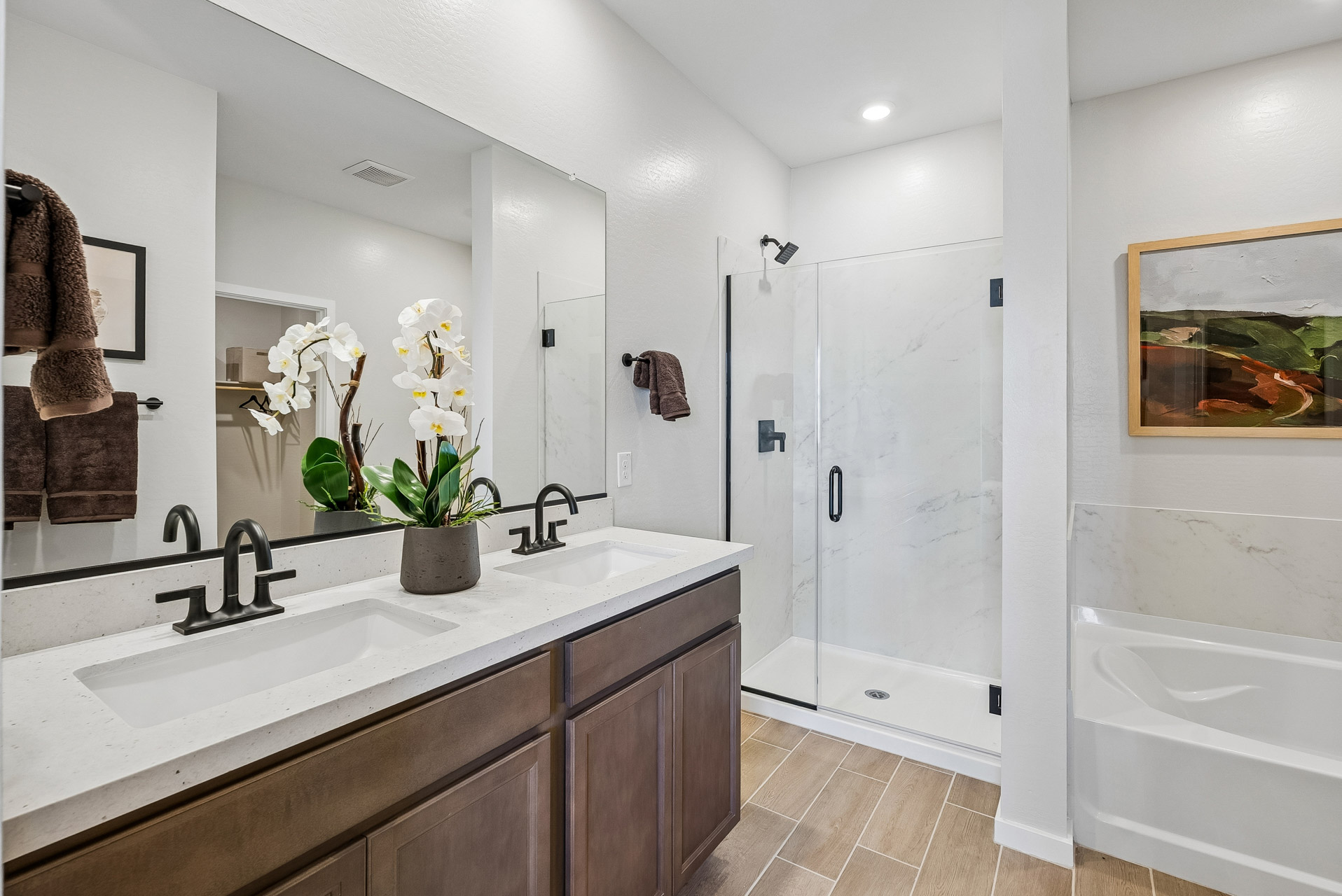 A bathroom with a large mirror.