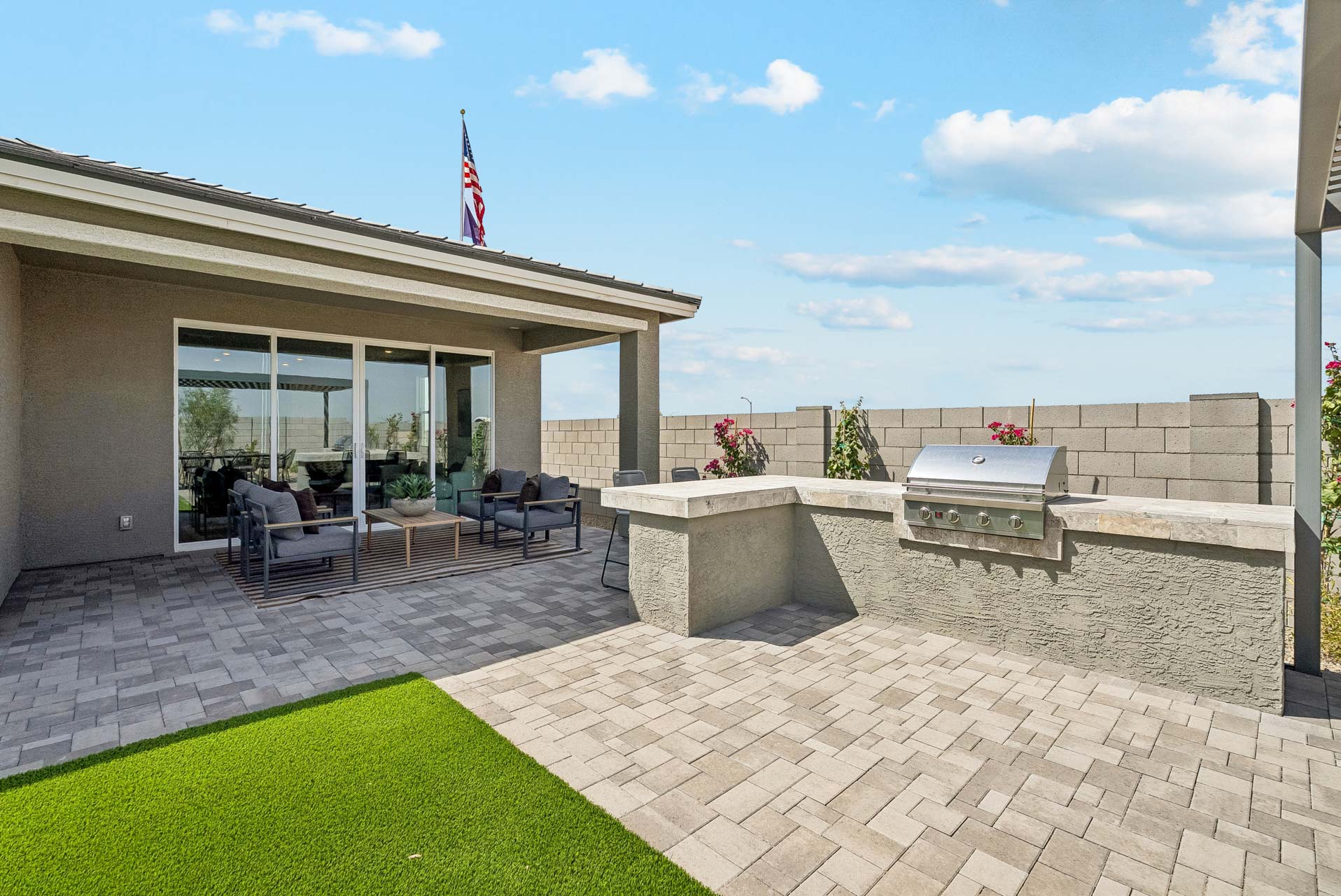 A building with a stone patio.
