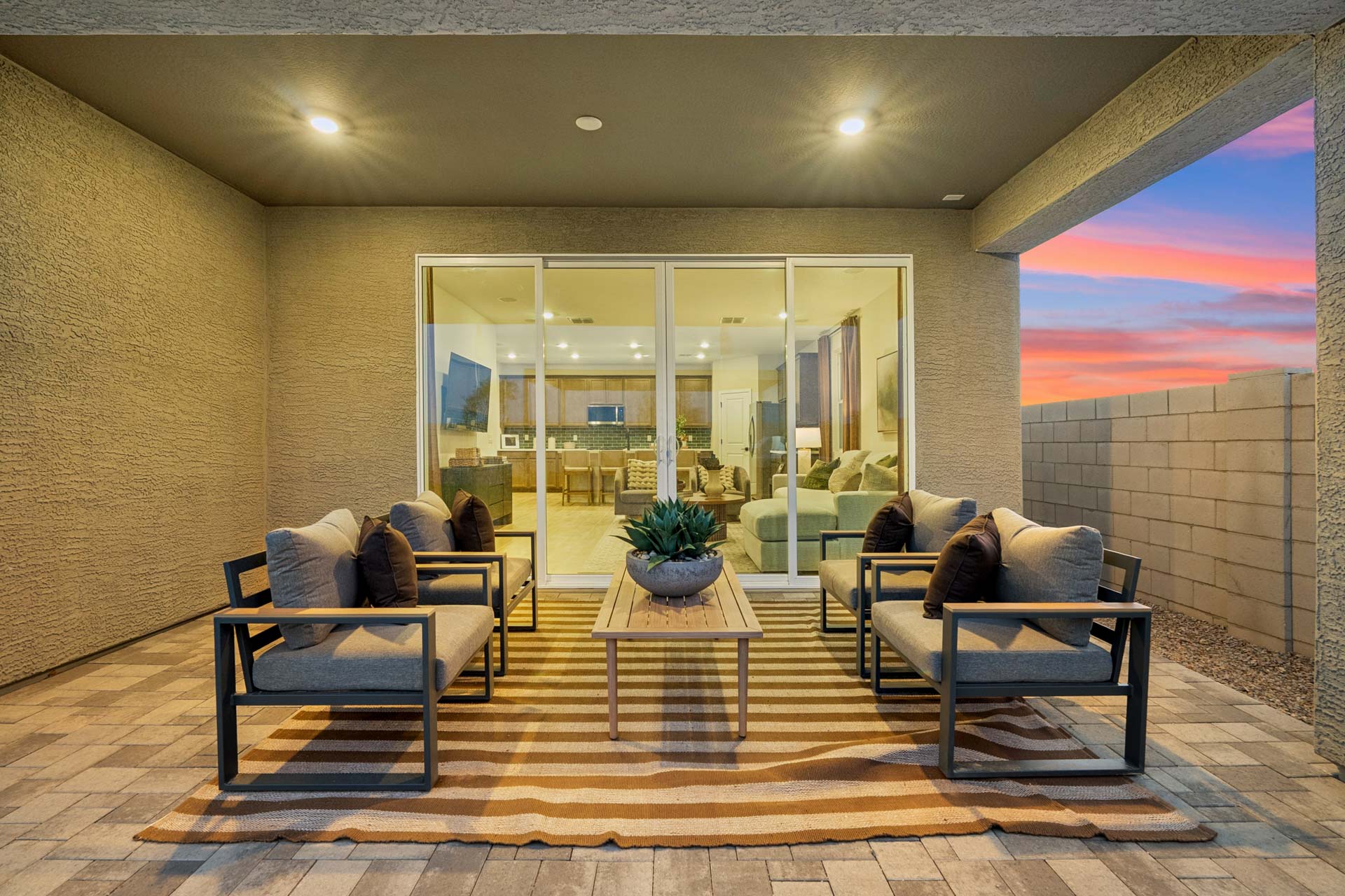 A living room with a large glass wall.