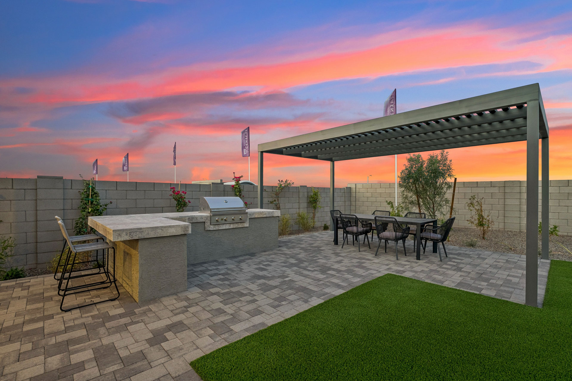 A patio with a table and chairs.