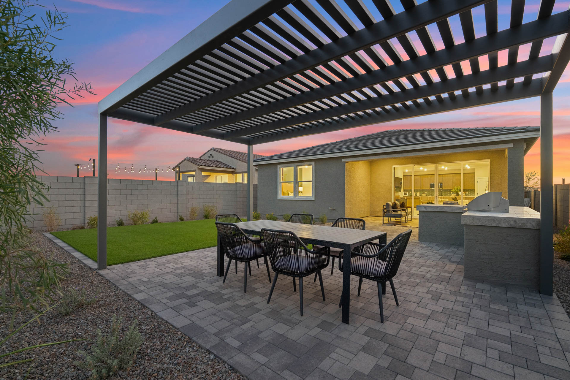 A patio with a table and chairs.