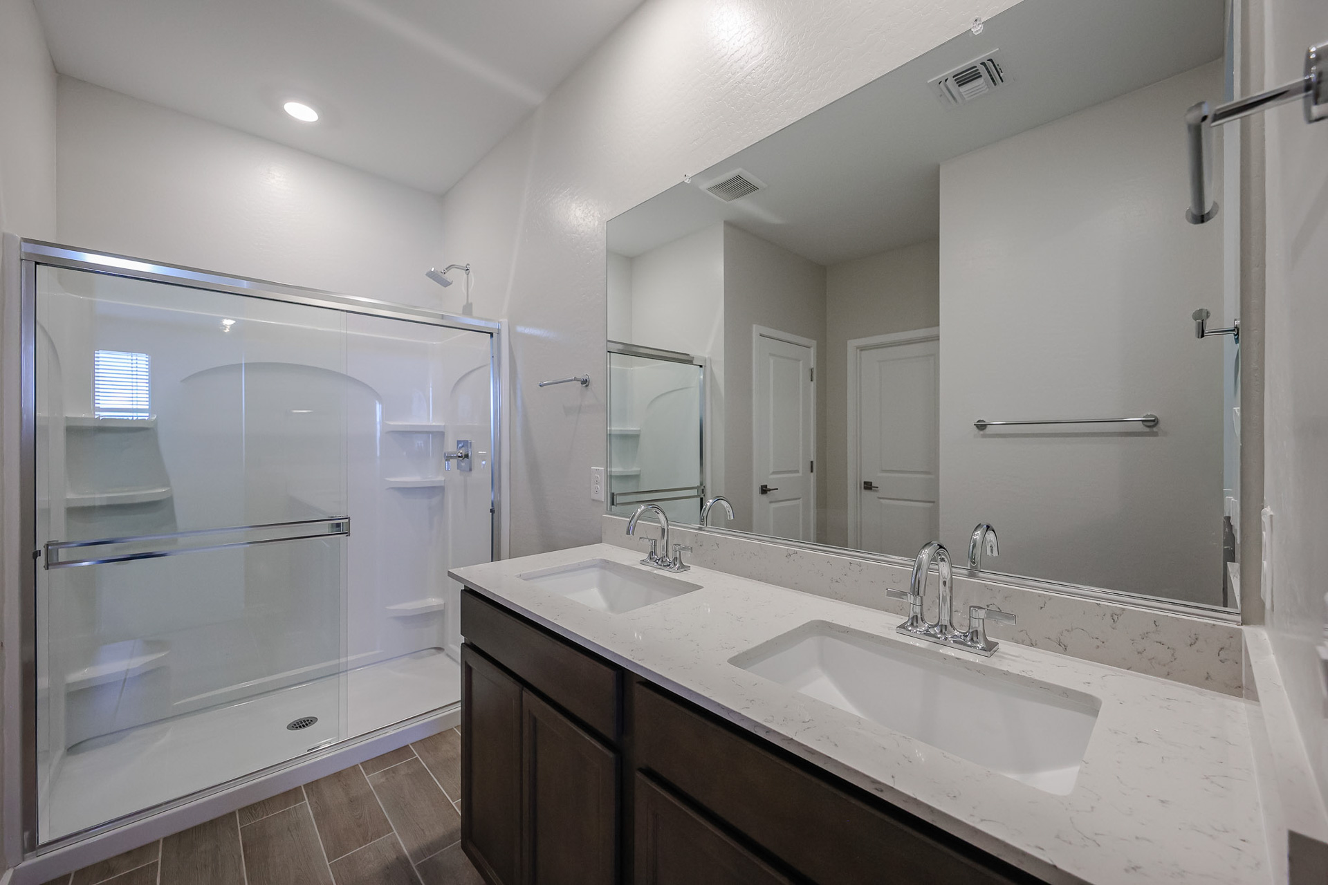 A bathroom with a glass shower.
