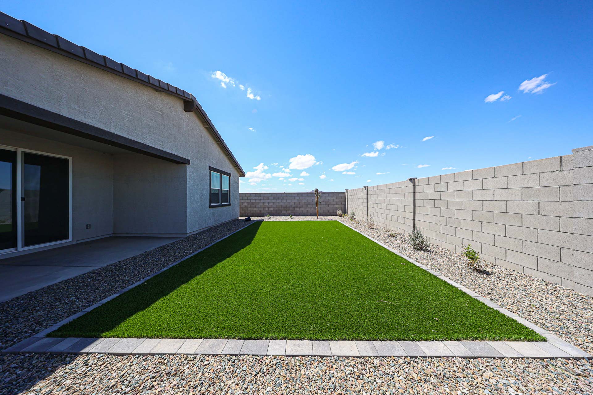 A house with a green lawn.