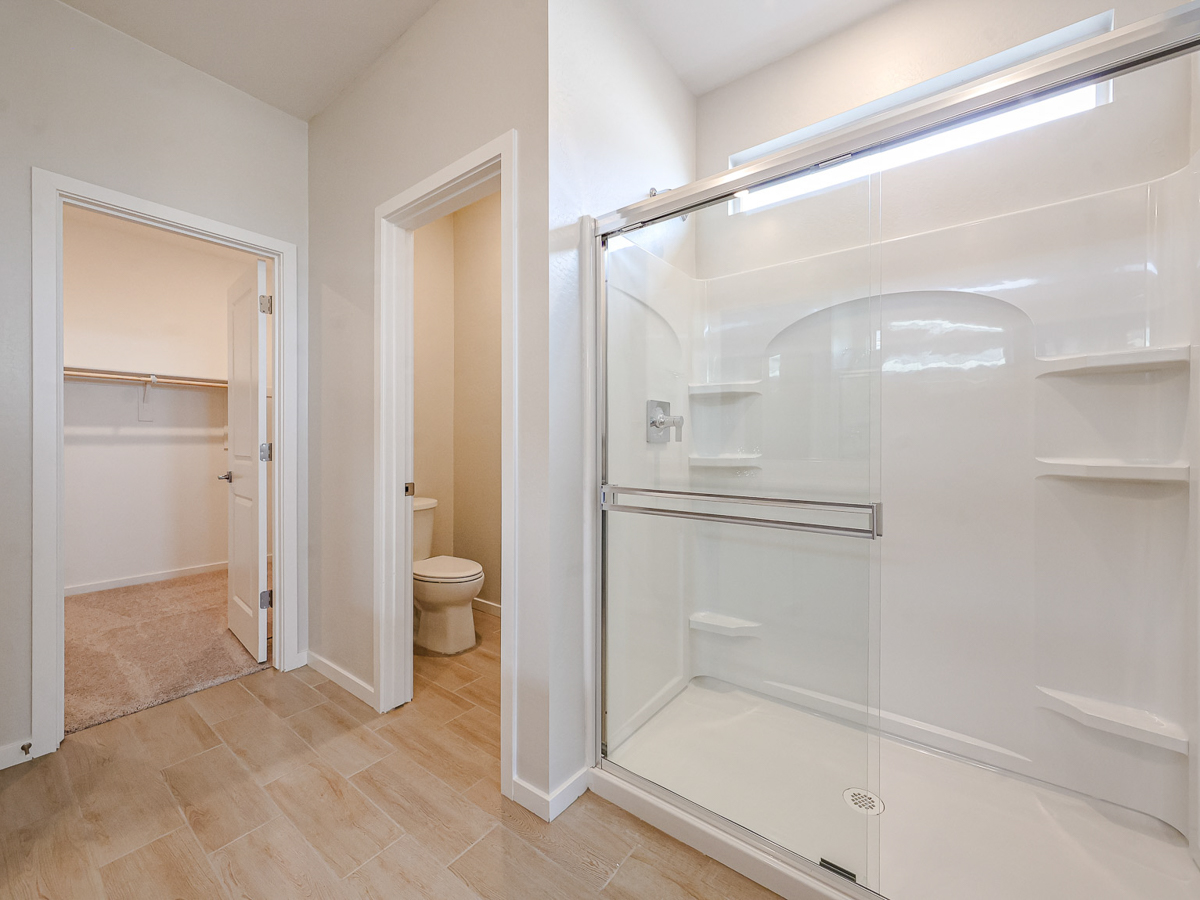 A bathroom with a glass shower.