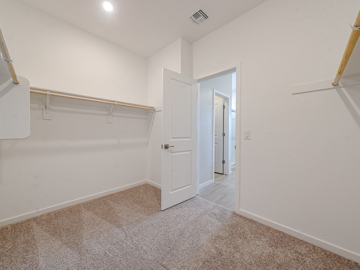 A hallway with white walls.