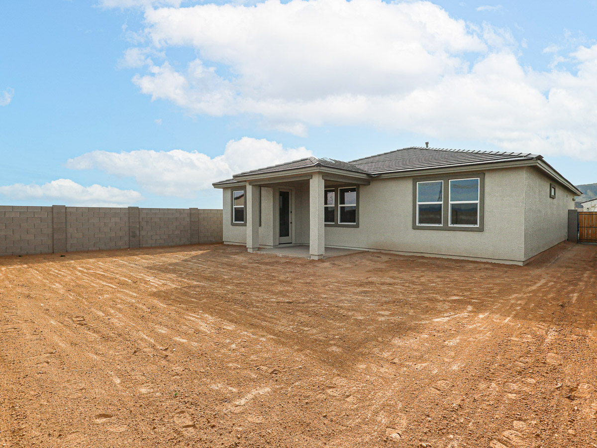 A house with a dirt yard.