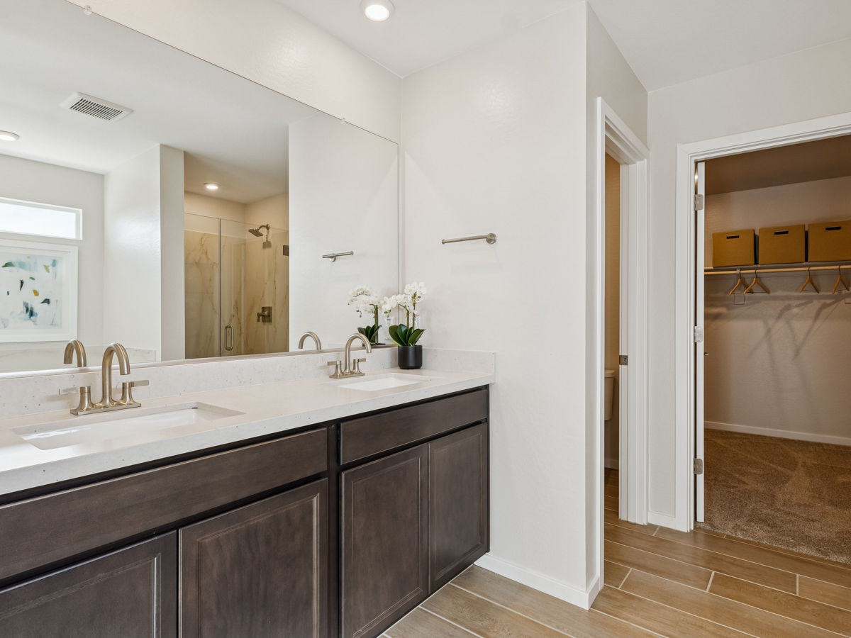 A bathroom with a tub sink and a shower.