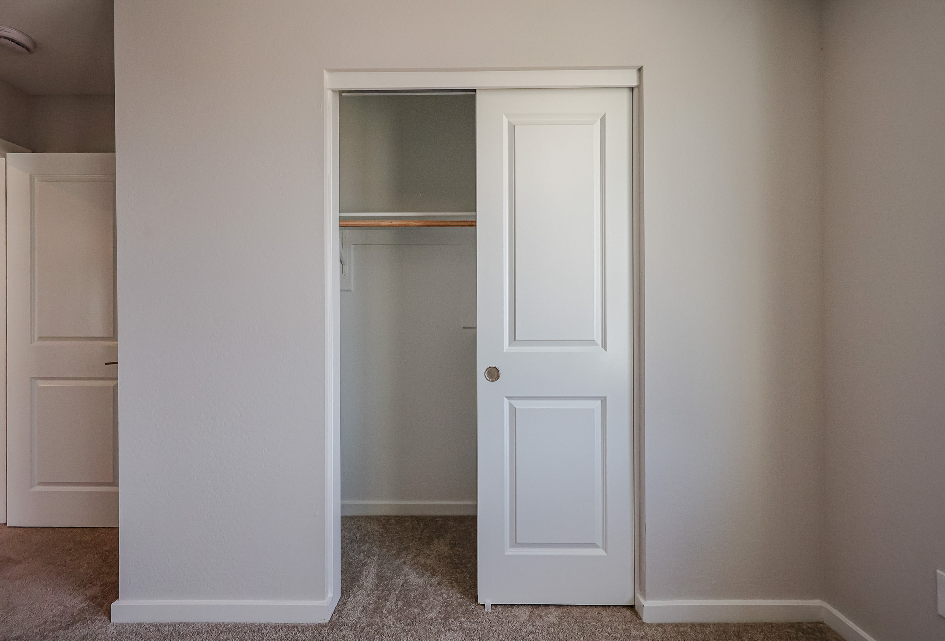 A white door in a room.