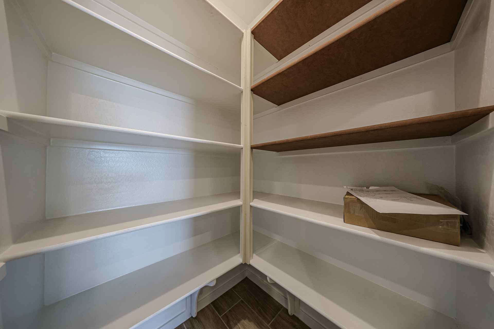 A shelf with a box on it.