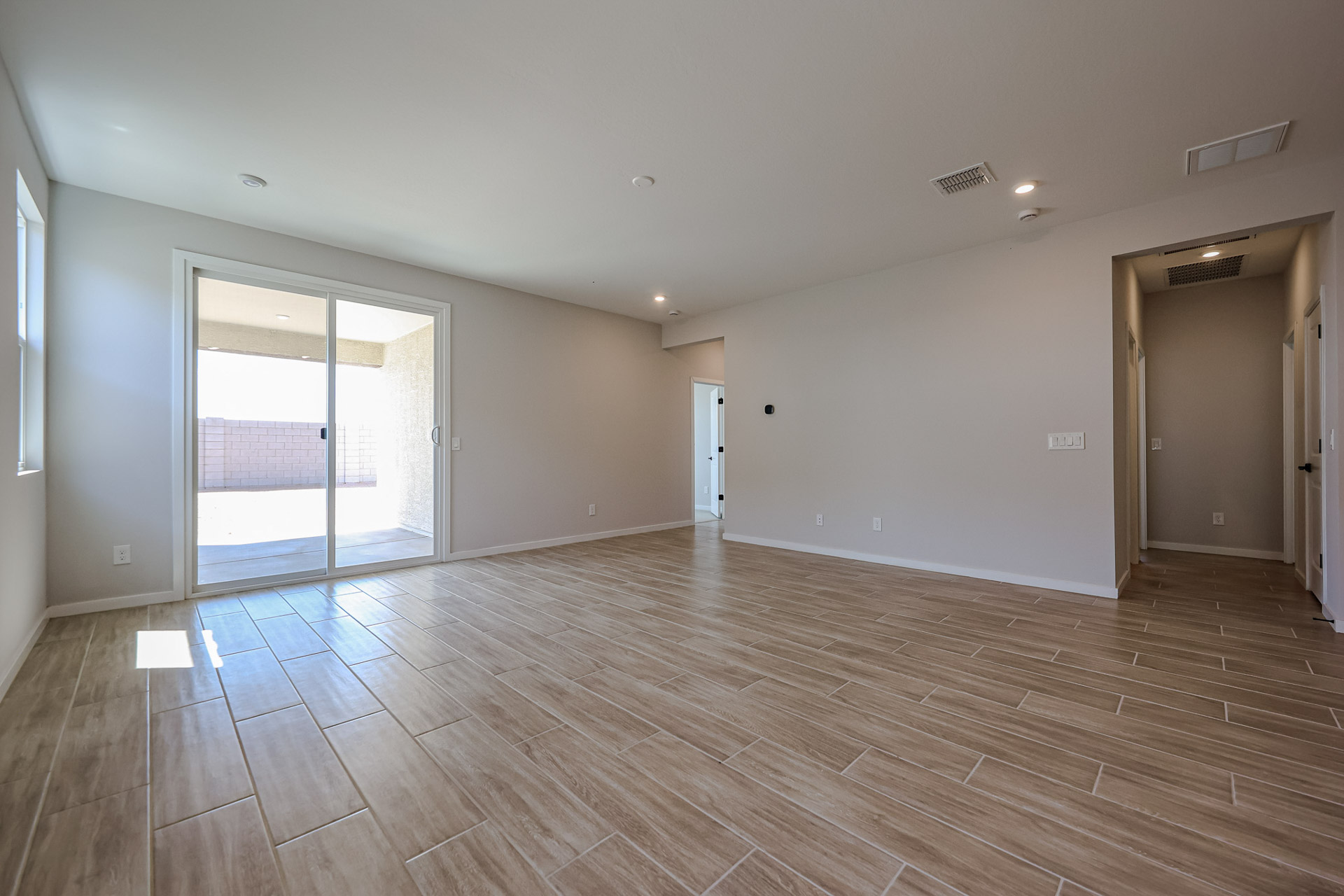 A room with a wood floor and a wood floor.