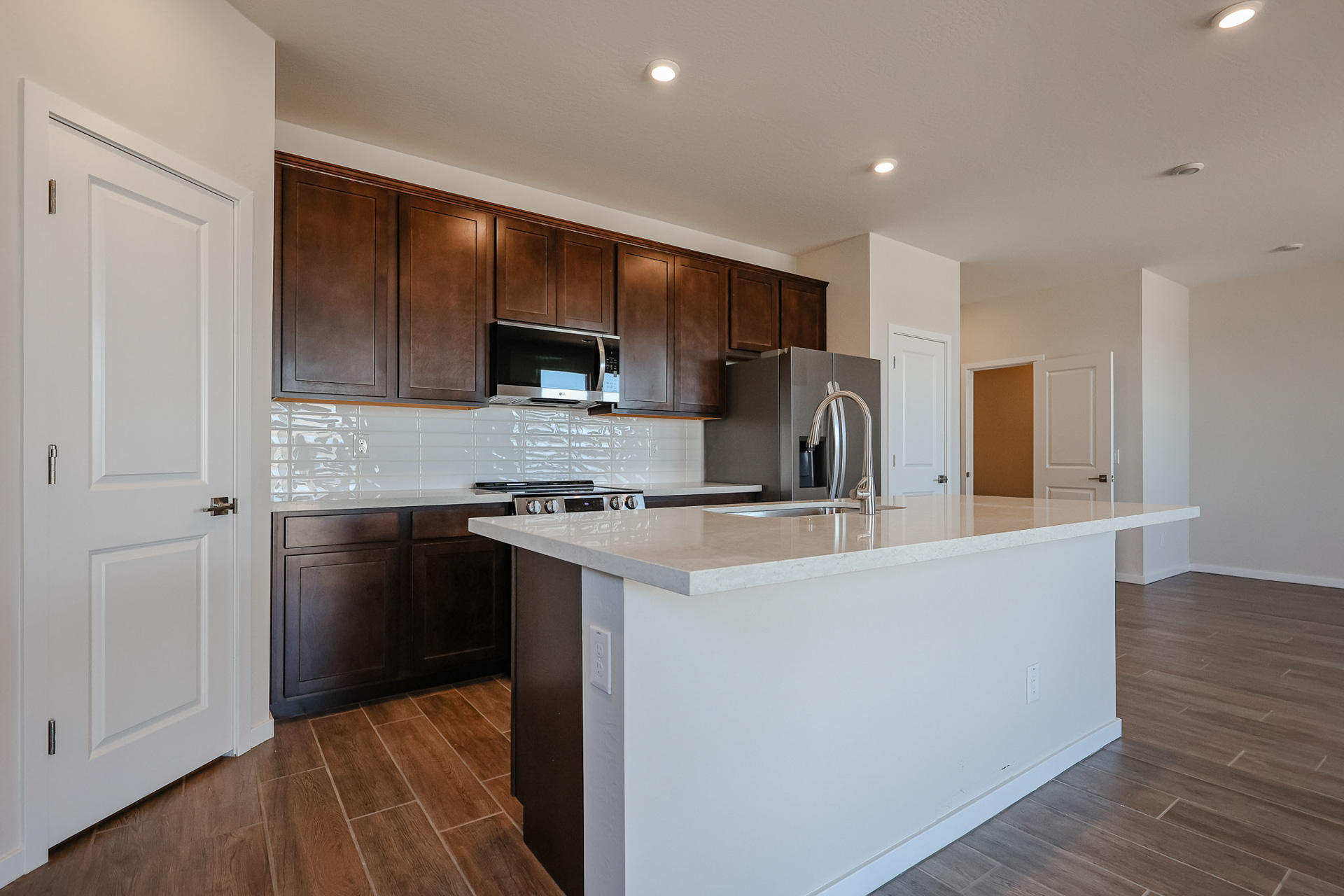 A kitchen with wooden cabinets.