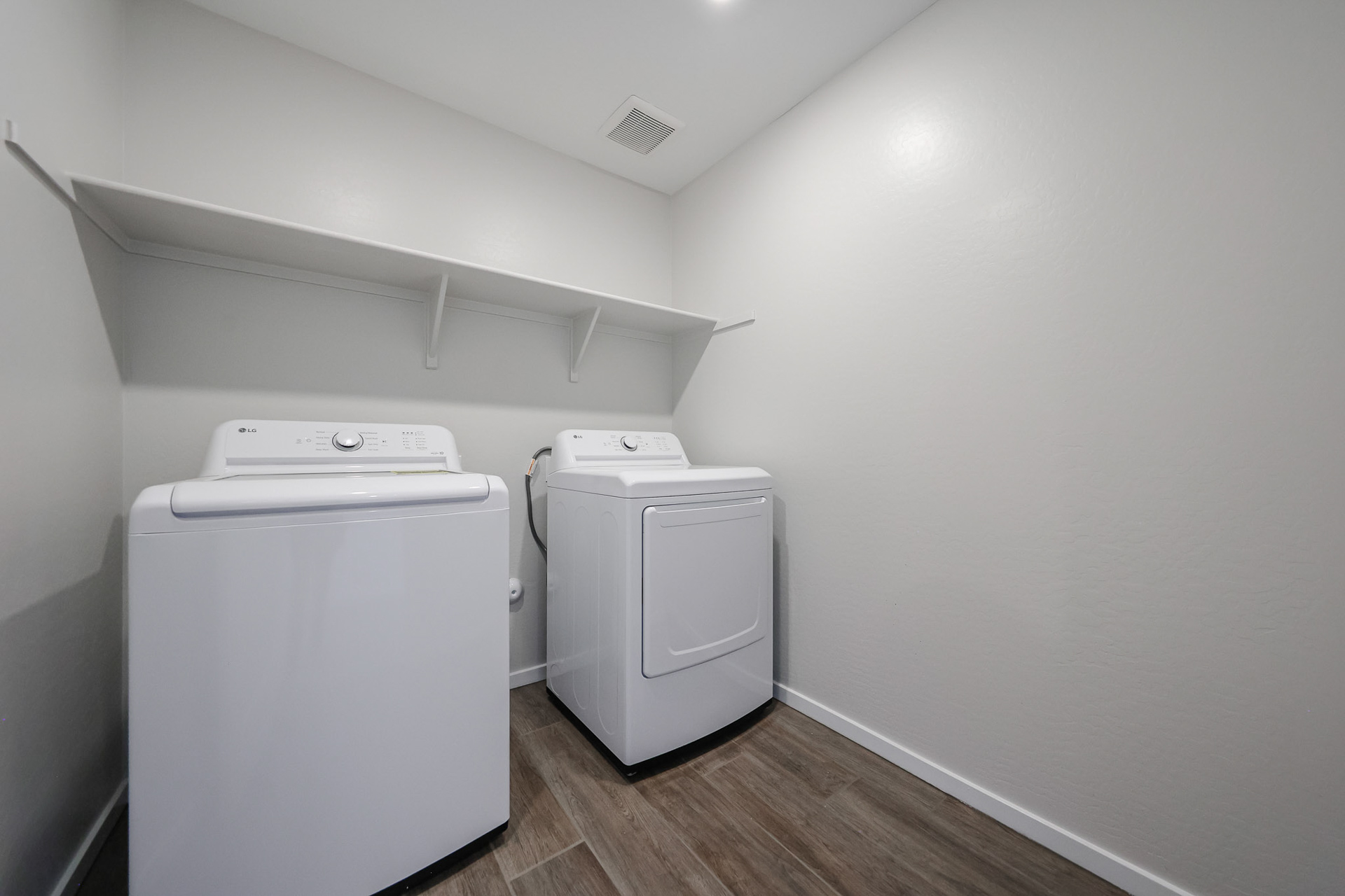 A white washing machine in a room.